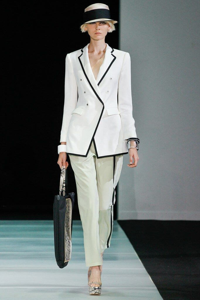 A picture of a model on the catwalk for  Emporio Armani SS 2012.