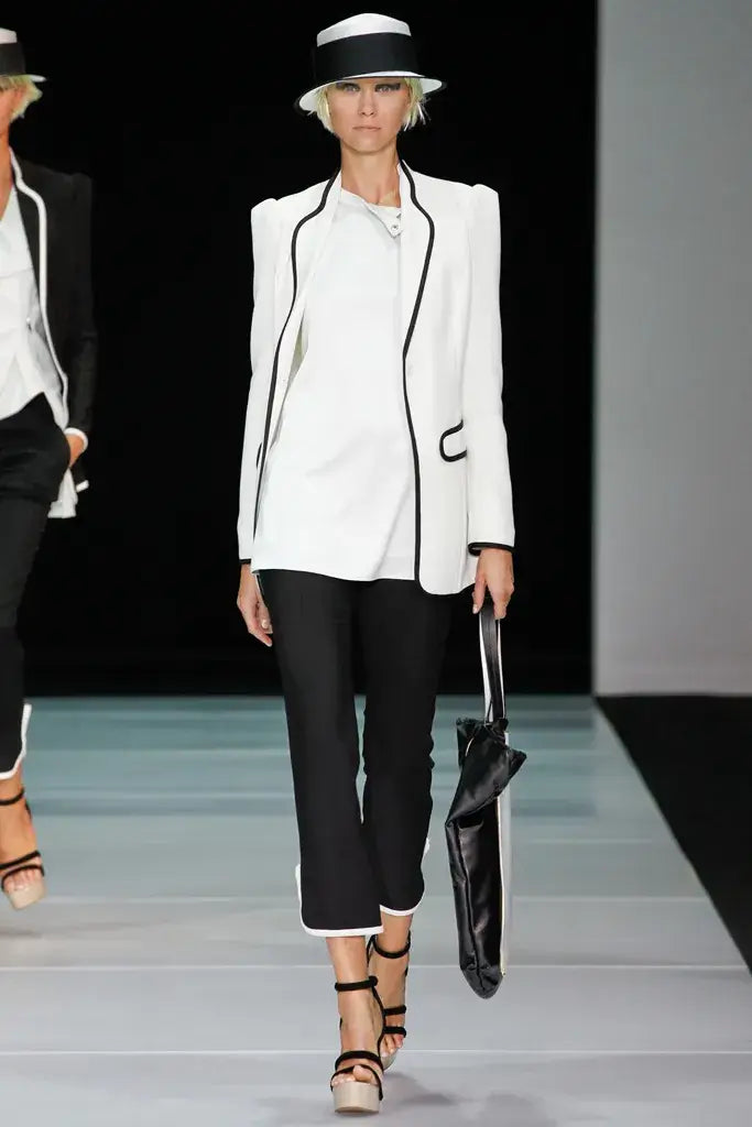 A picture of a model on the catwalk for  Emporio Armani SS 2012.