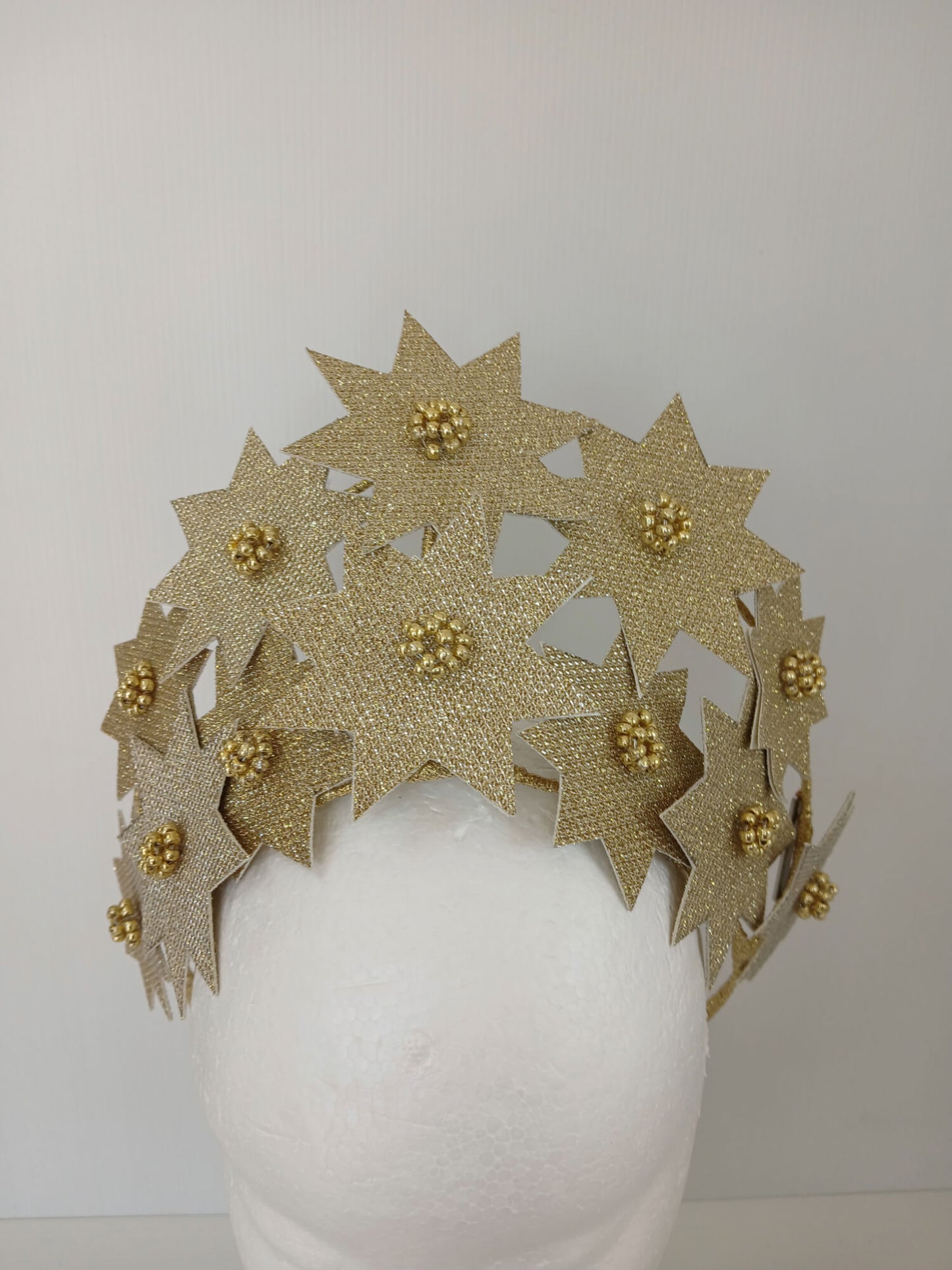 A picture of a Gold Pleather Millinery Crown by Melissa Rath Millinery.