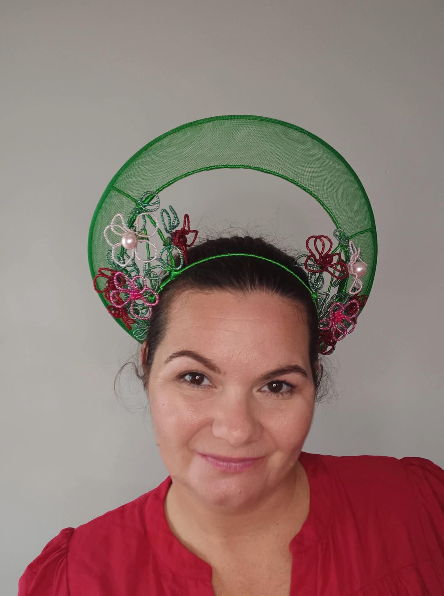 A picture of a Green Beaded Crown by Melissa Rath Millinery.