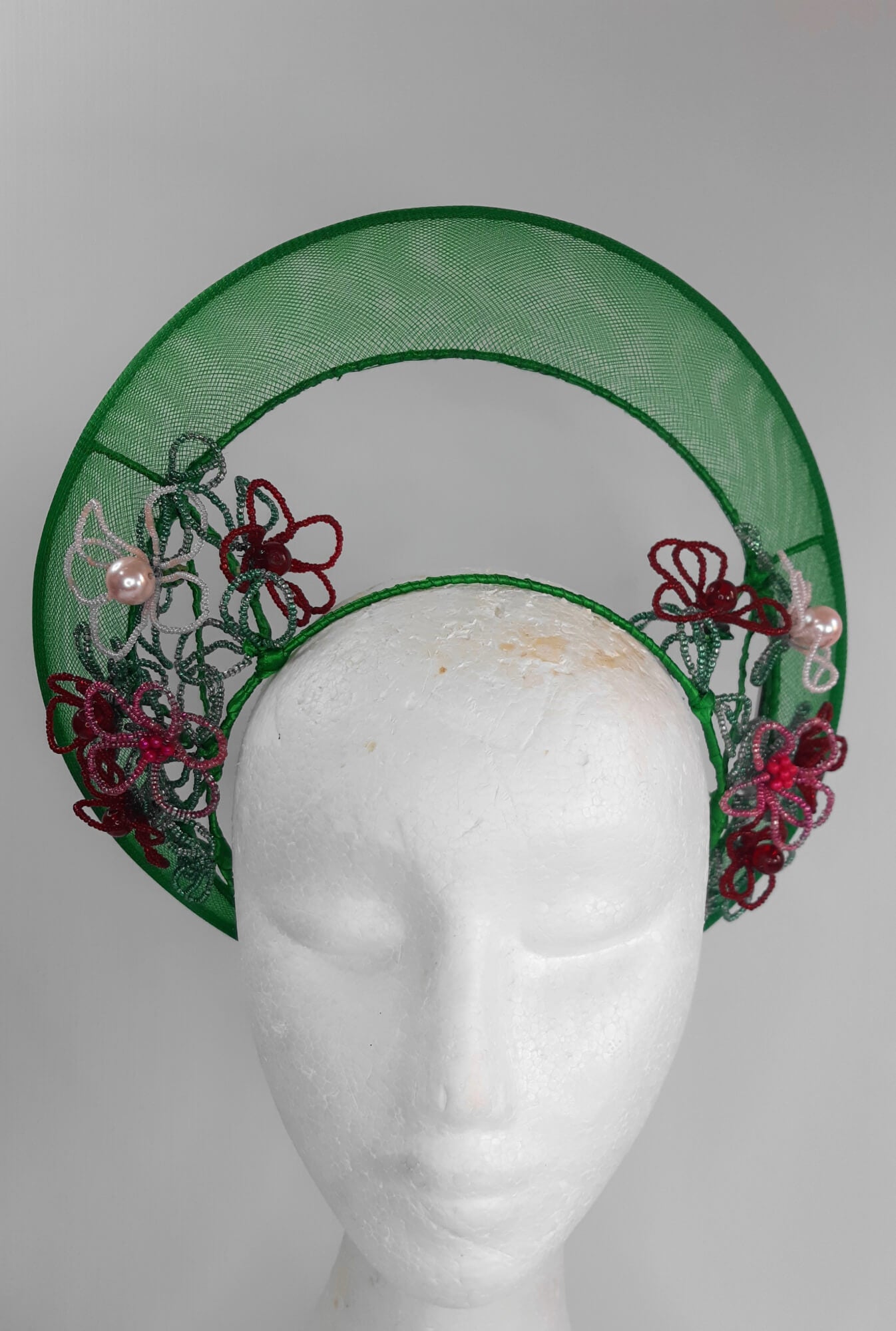 A picture of a Green Beaded Crown by Melissa Rath Millinery.