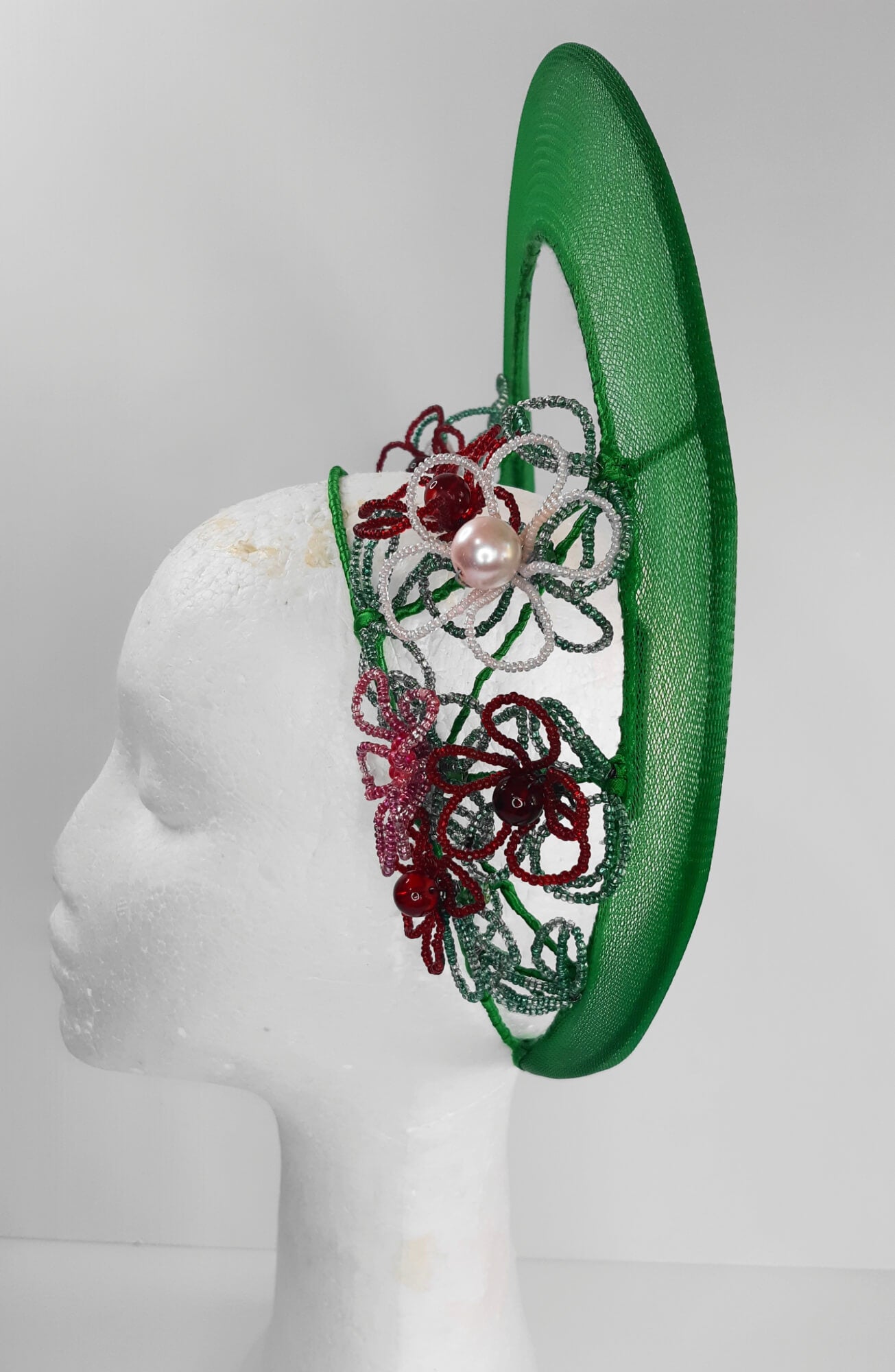 A picture of a Green Beaded Crown by Melissa Rath Millinery.