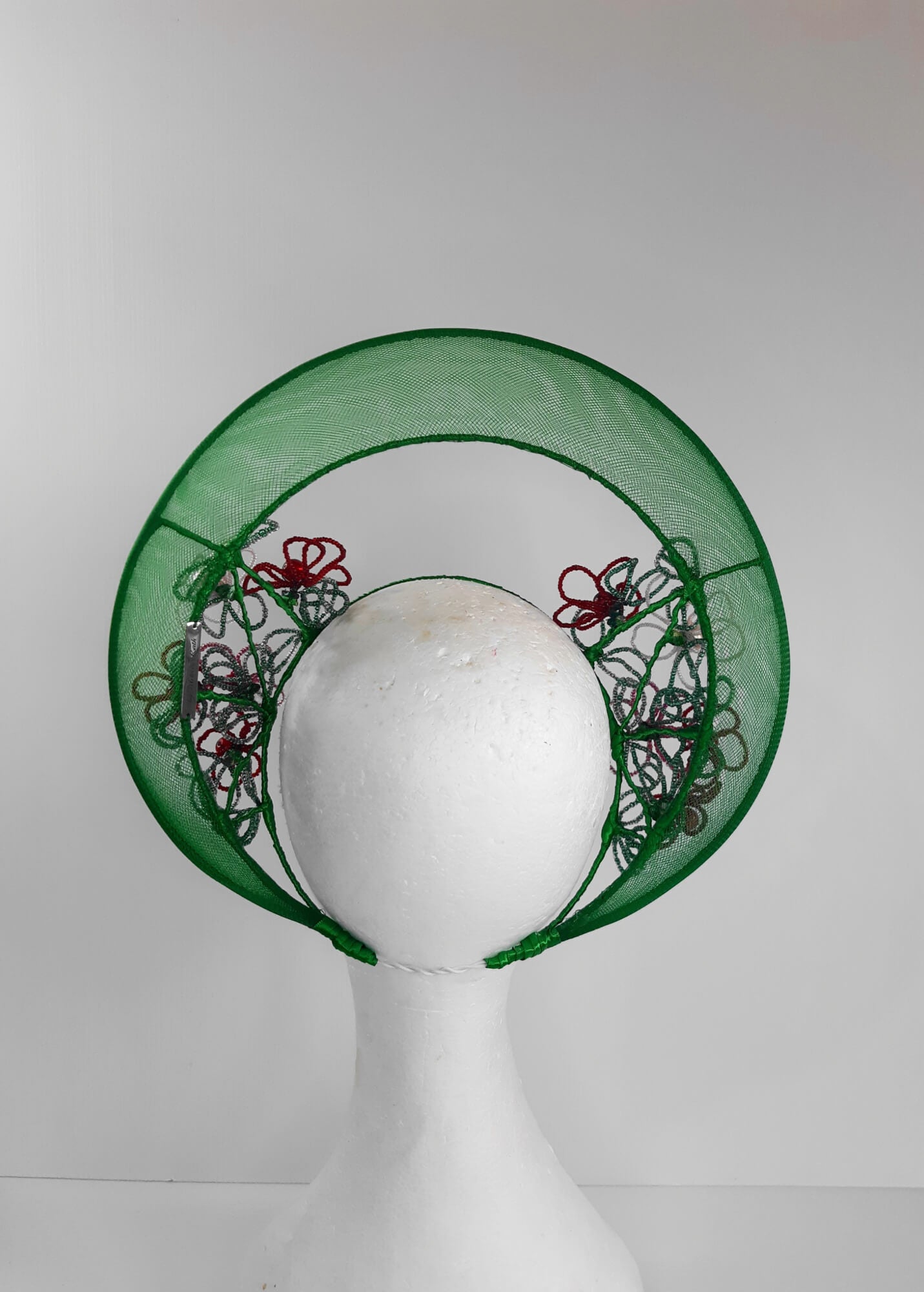 A picture of a Green Beaded Crown by Melissa Rath Millinery.