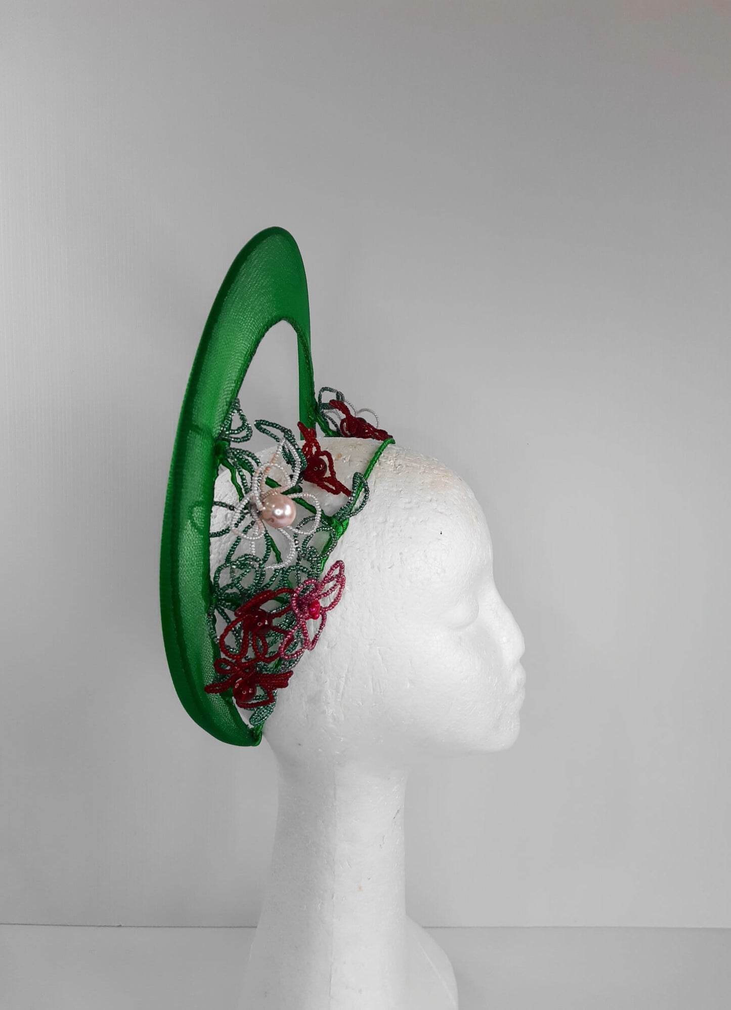 A picture of a Green Beaded Crown by Melissa Rath Millinery.