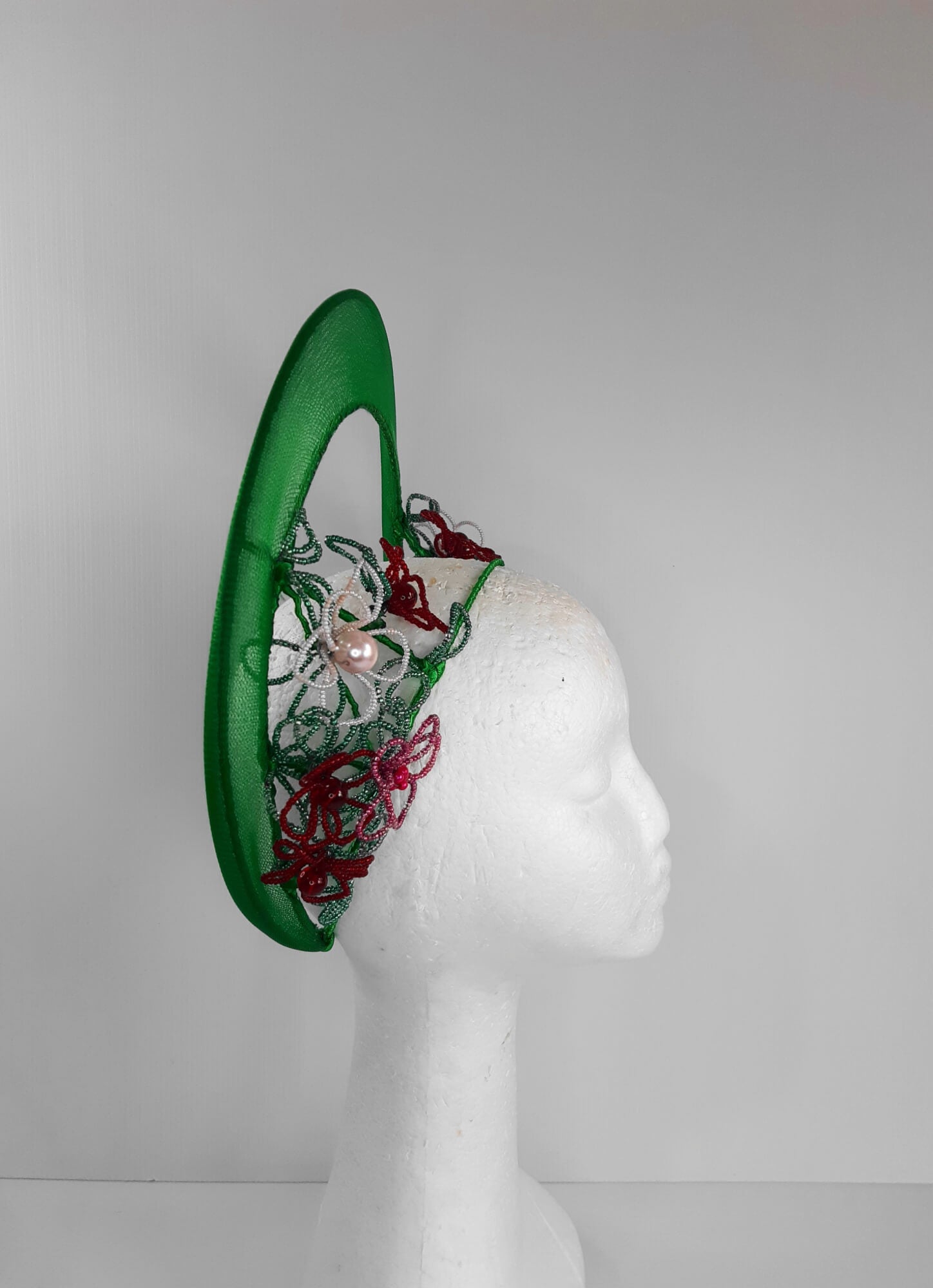 A picture of a Green Beaded Crown by Melissa Rath Millinery.