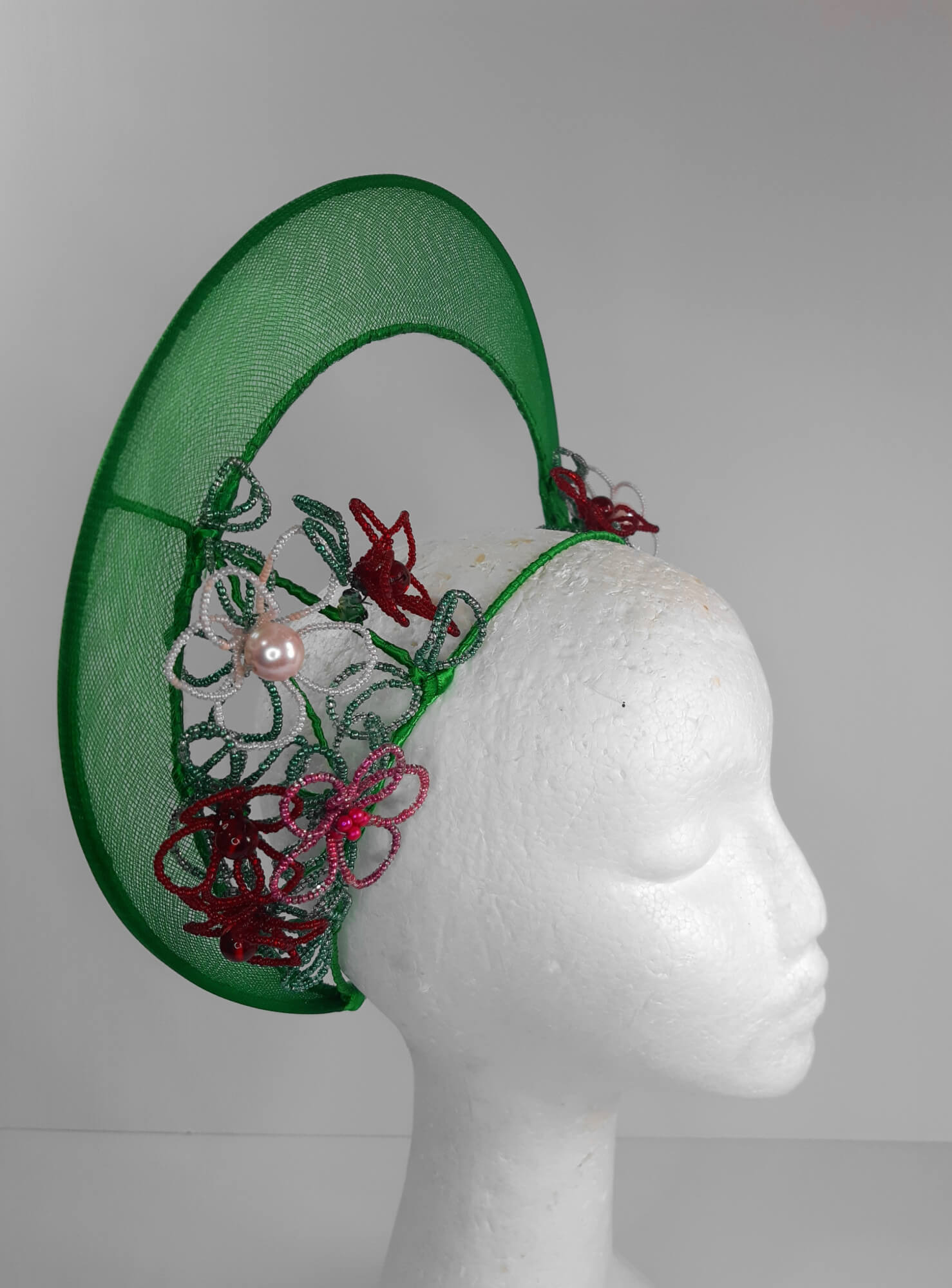 A picture of a Green Beaded Crown by Melissa Rath Millinery.