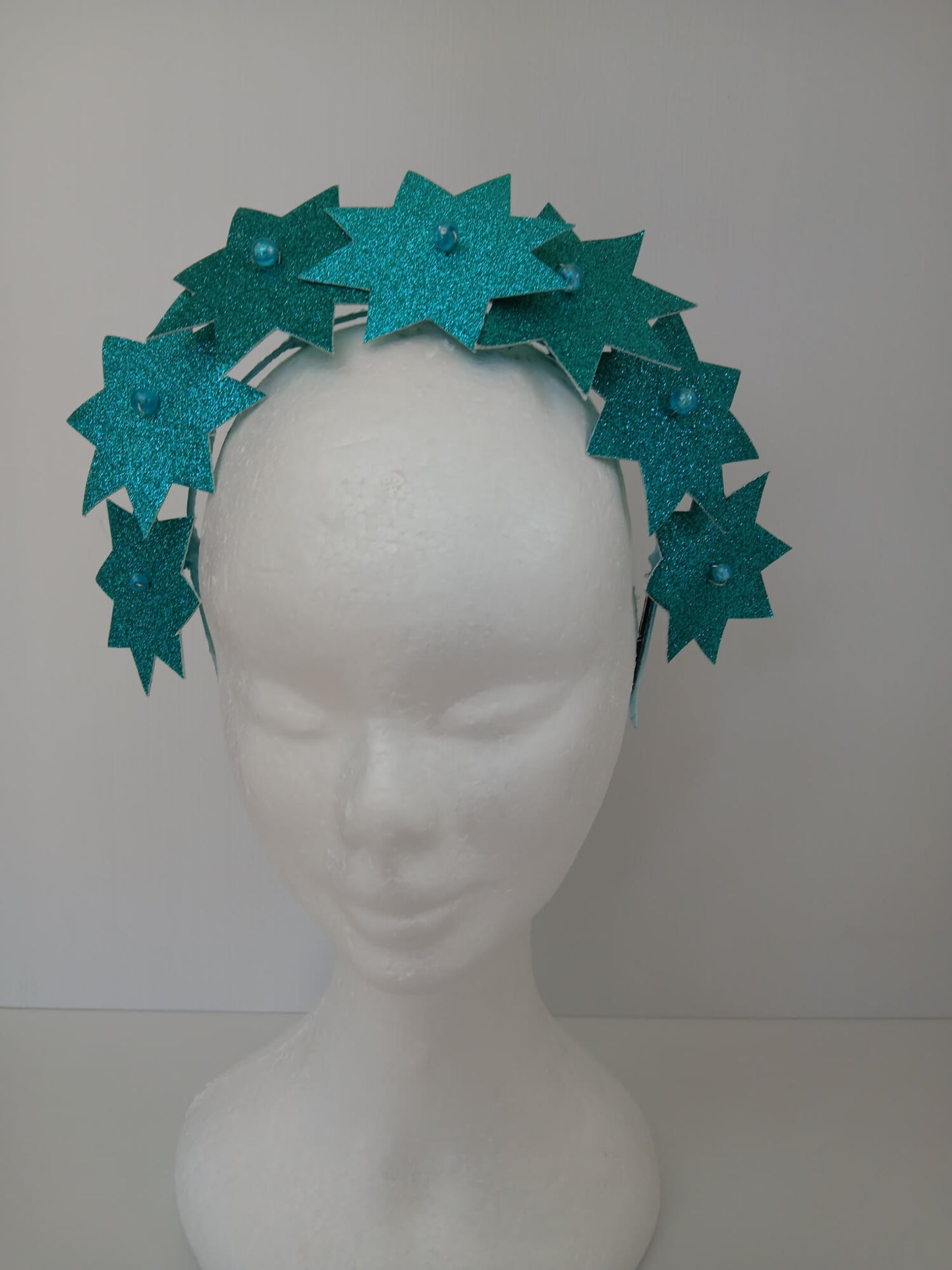A picture of a Green Pleather Millinery Headband by Melissa Rath Millinery.