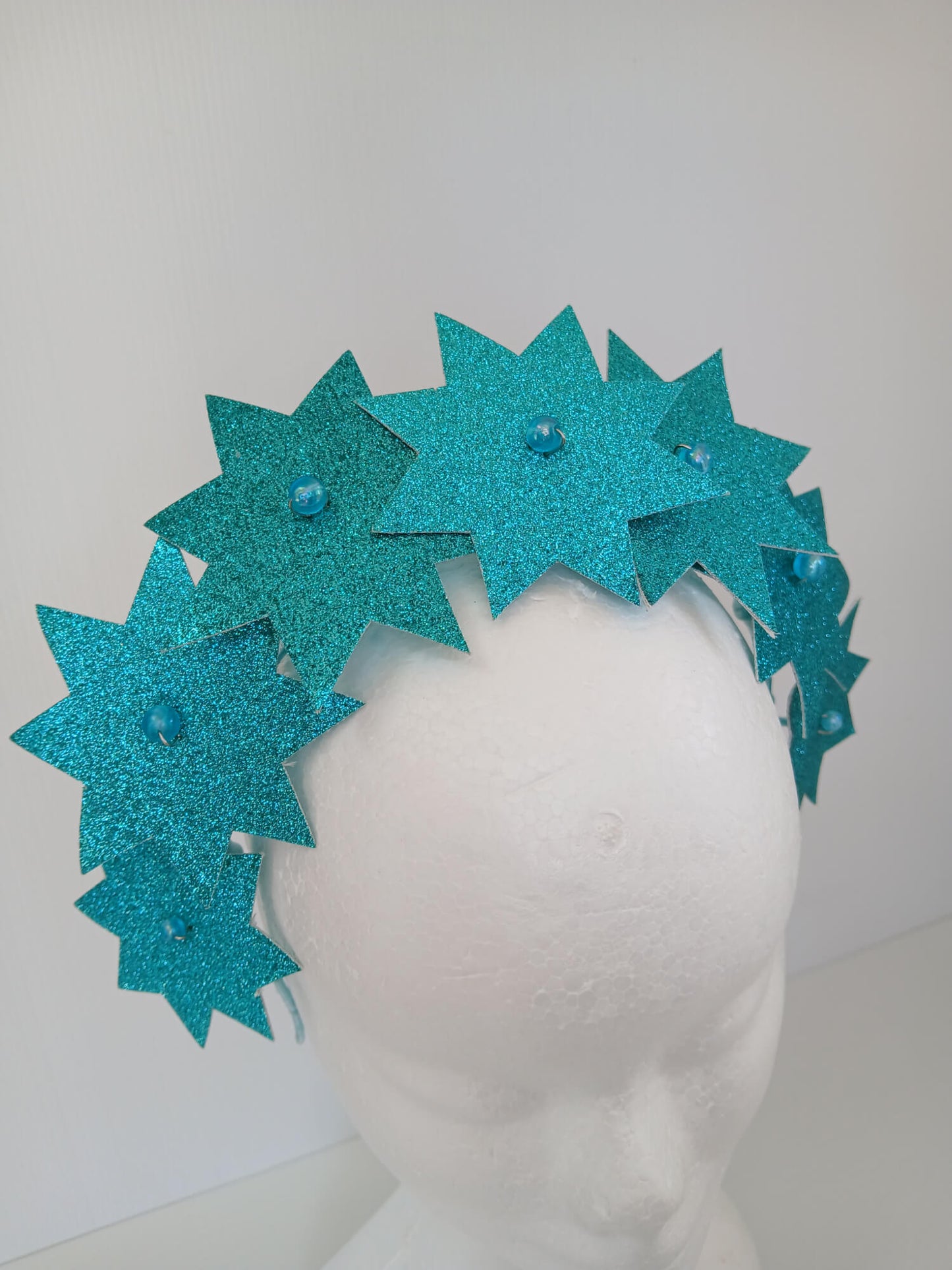 A picture of a Green Pleather Millinery Headband by Melissa Rath Millinery.
