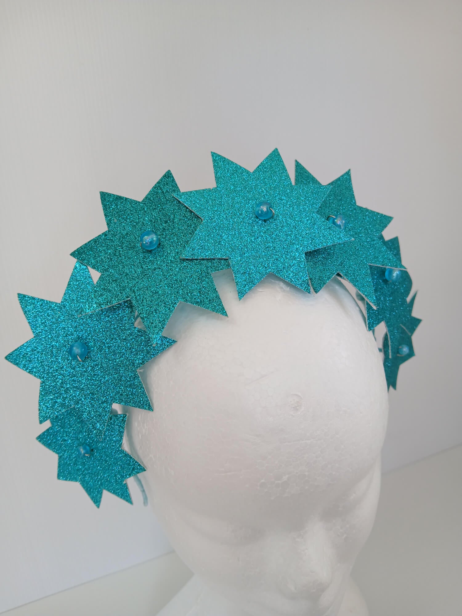 A picture of a Green Pleather Millinery Headband by Melissa Rath Millinery.