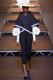 A picture of a model on the catwalk for  Jacquemus SS 2017.