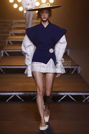 A picture of a model on the catwalk for  Jacquemus SS 2017.