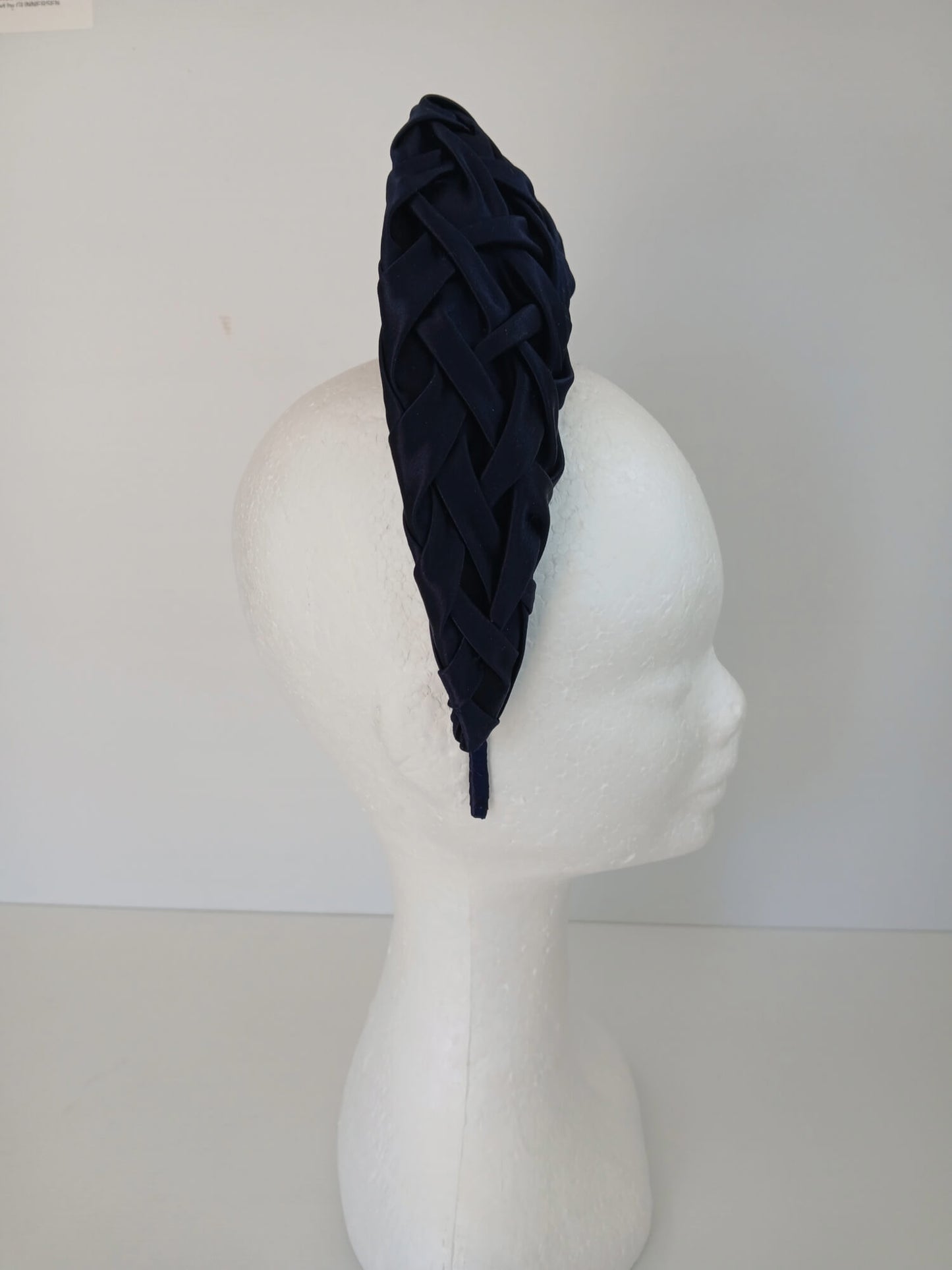 A picture of a Navy Blocked Smocked Millinery Crown by Melissa Rath Millinery