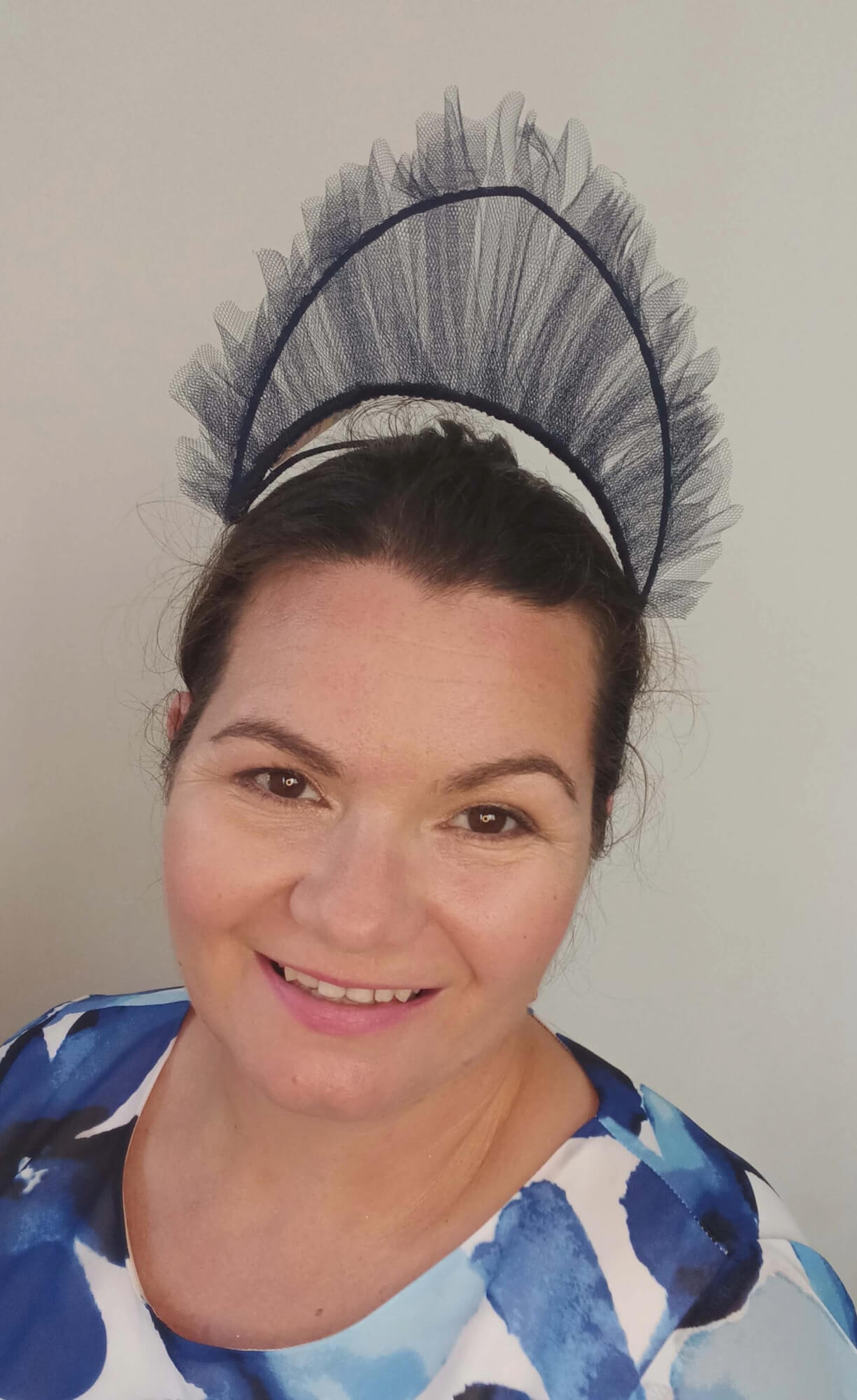 A picture of a Navy Tulle Crown by Melissa Rath Millinery.