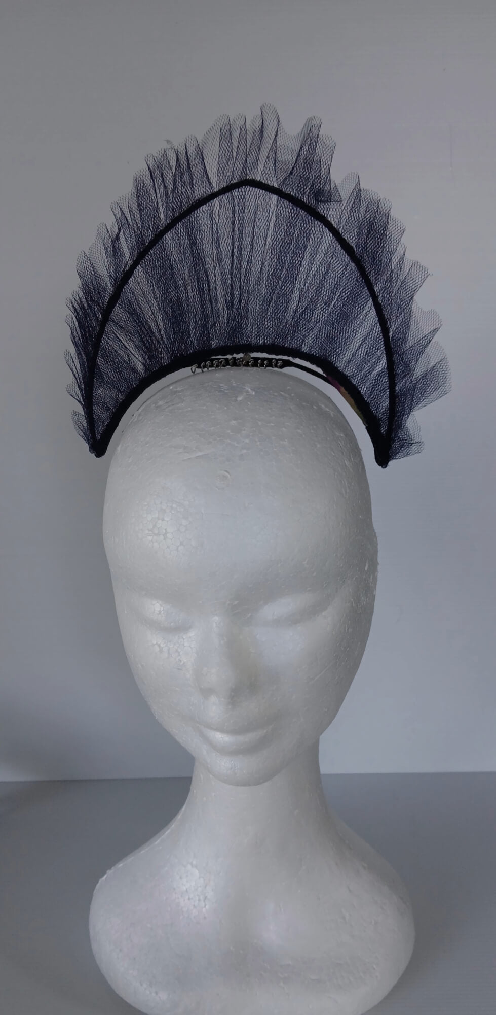 A picture of a Navy Tulle Crown by Melissa Rath Millinery.