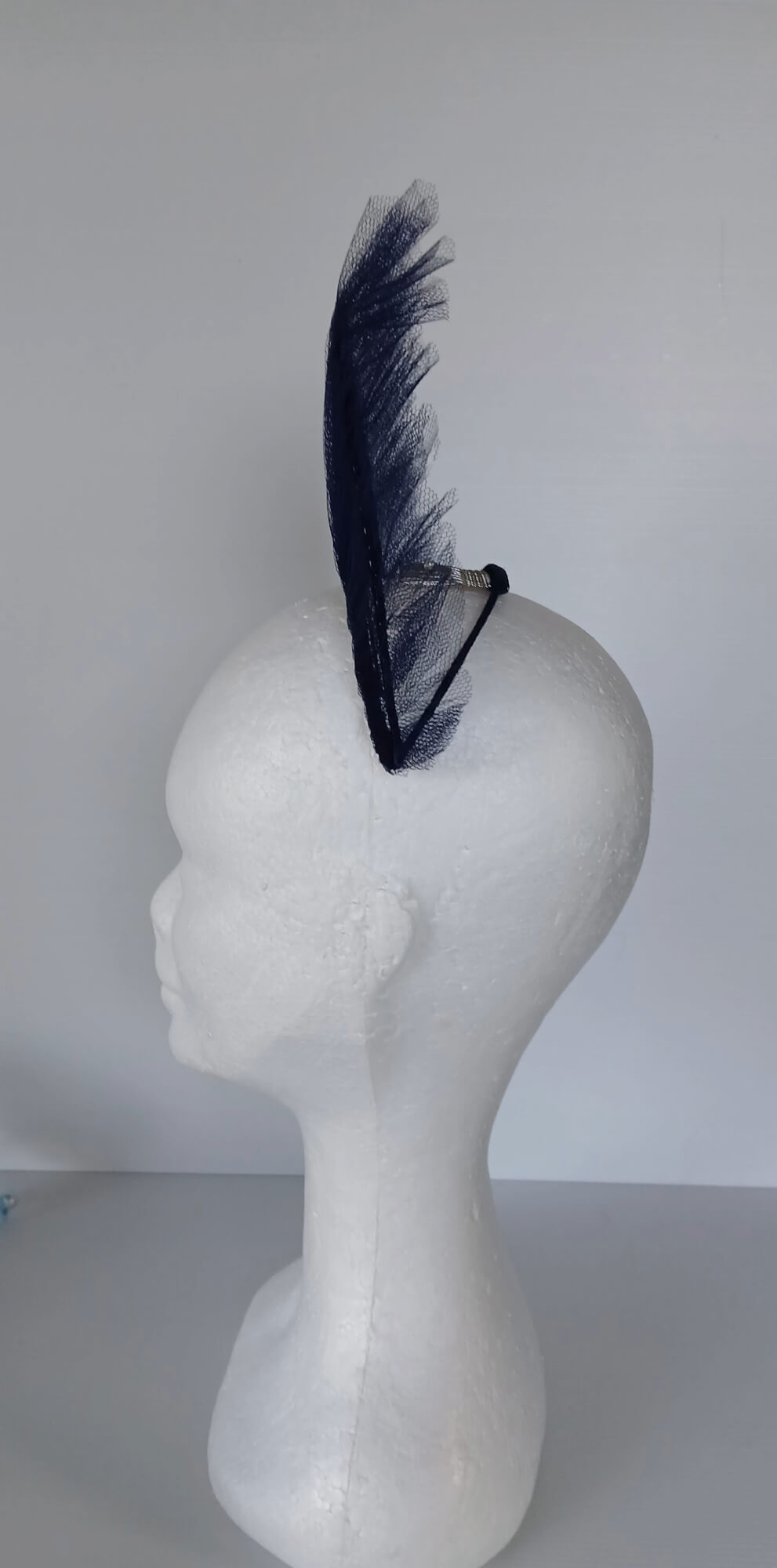 A picture of a Navy Tulle Crown by Melissa Rath Millinery.