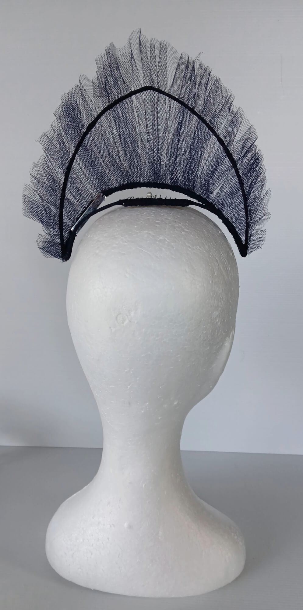 A picture of a Navy Tulle Crown by Melissa Rath Millinery.
