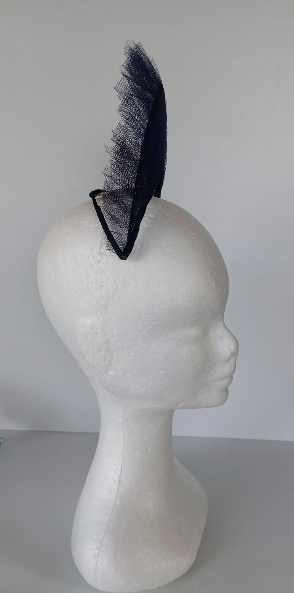 A picture of a Navy Tulle Crown by Melissa Rath Millinery.