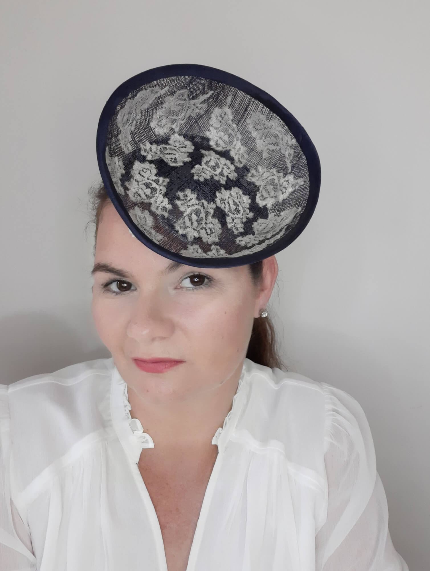 A picture of a Navy and White Saucer Hat by Melissa Rath Millinery.