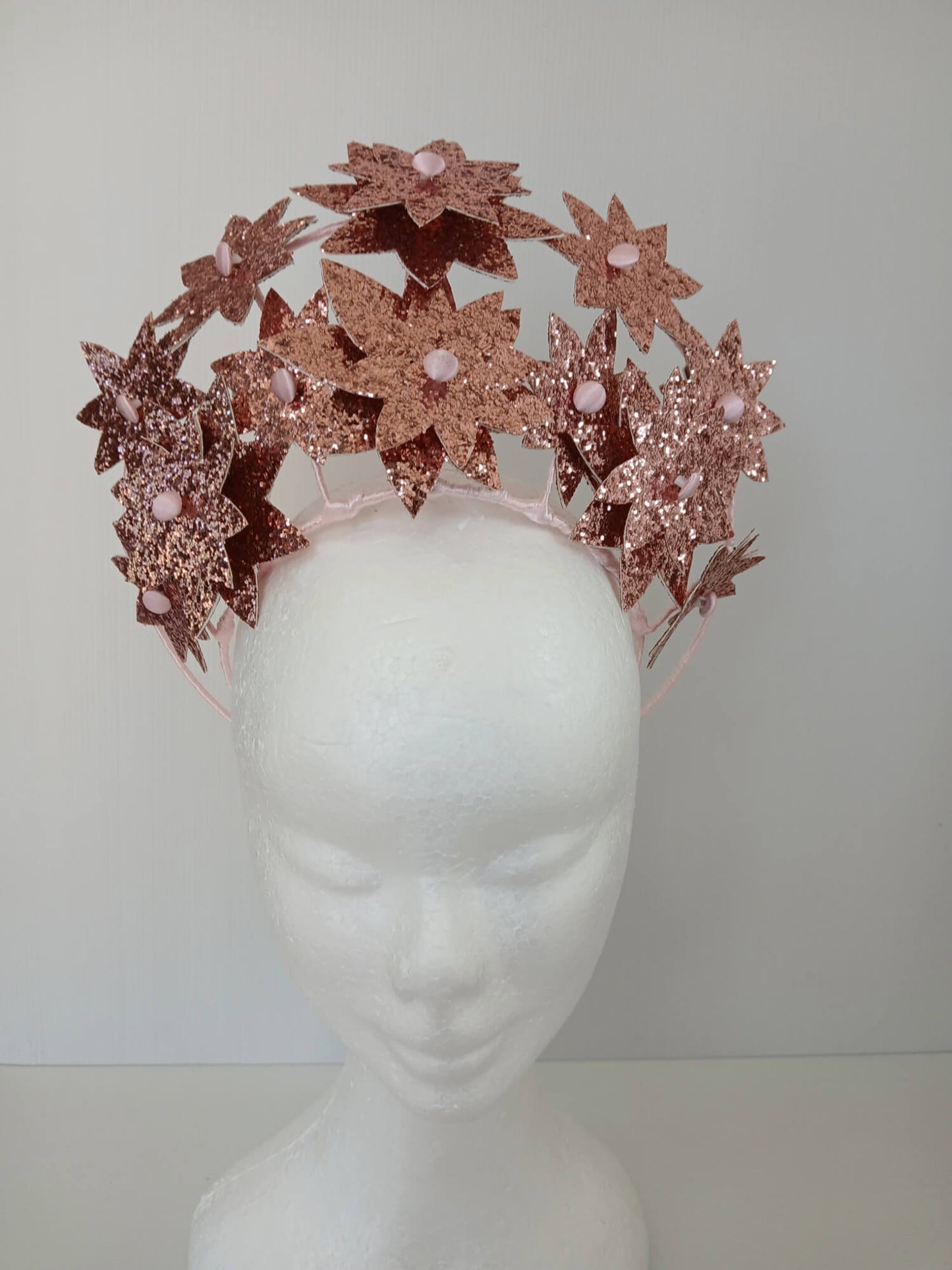 A picture of a Pink Pleather Millinery Crown by Melissa Rath Millinery.