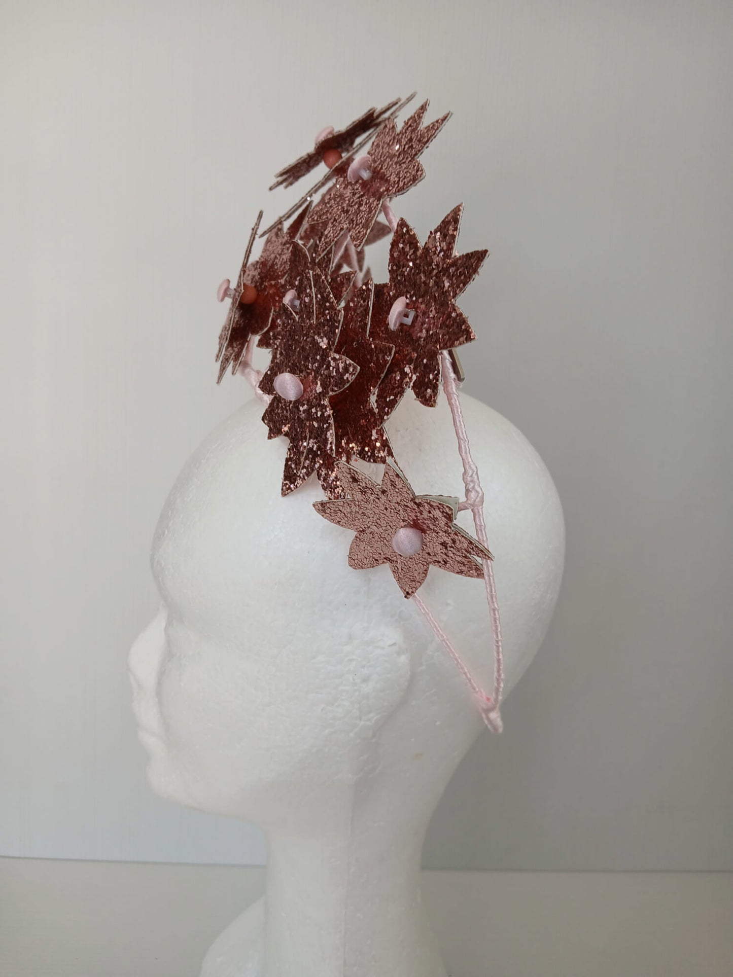 A picture of a Pink Pleather Millinery Crown by Melissa Rath Millinery.