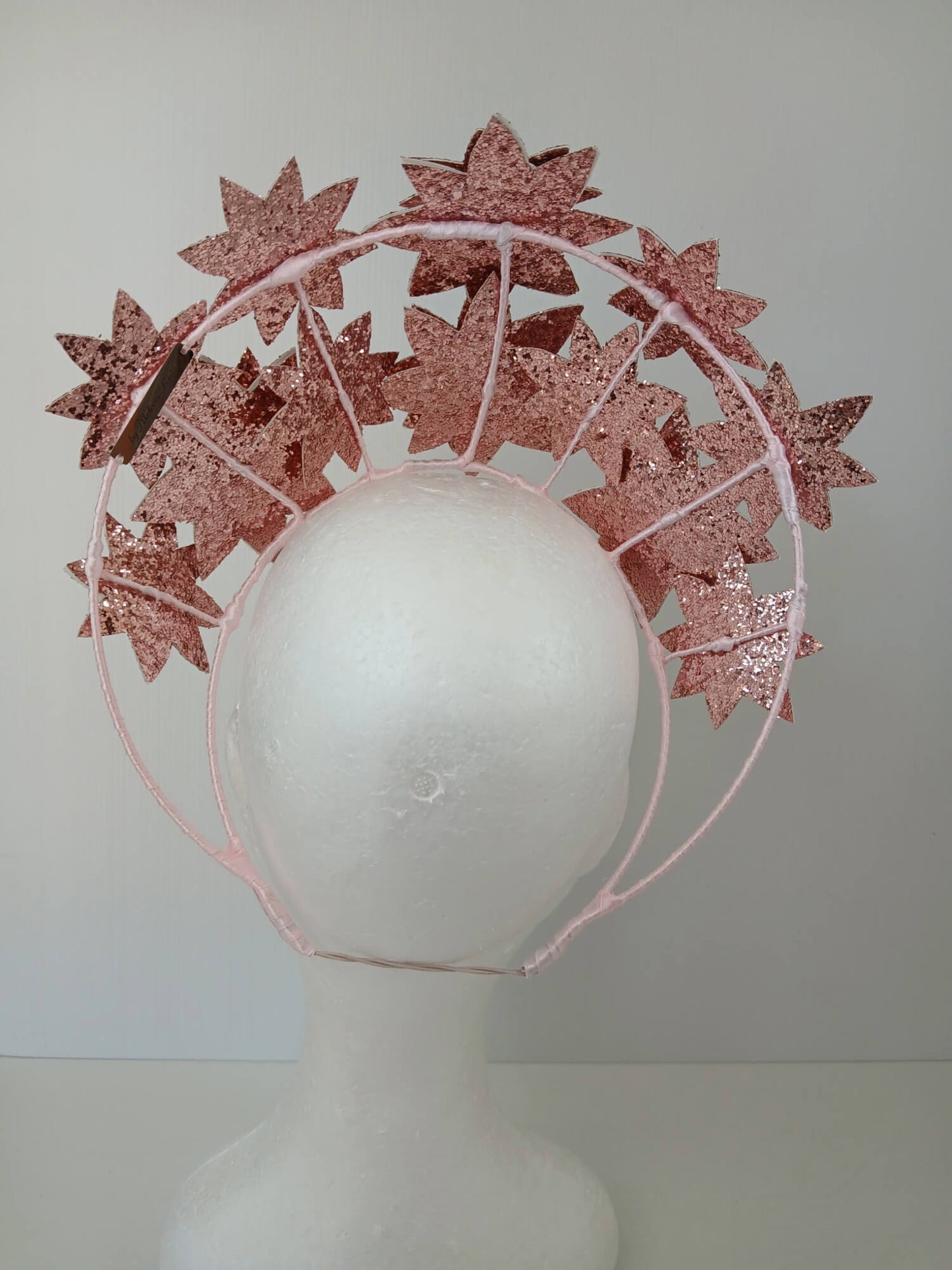 A picture of a Pink Pleather Millinery Crown by Melissa Rath Millinery.