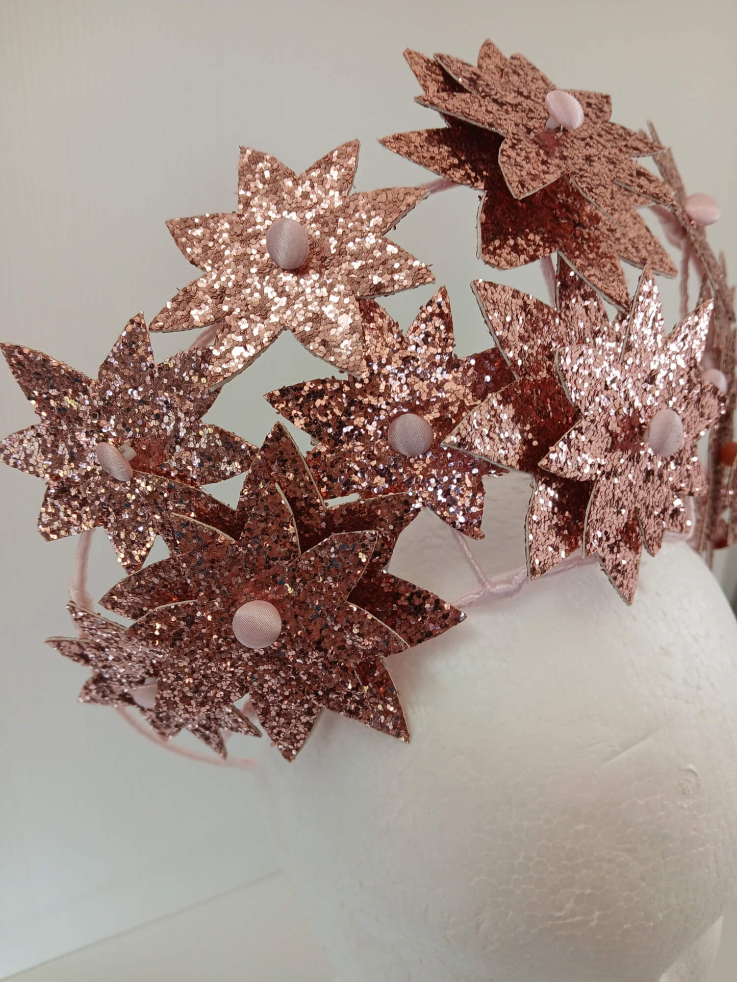 A picture of a Pink Pleather Millinery Crown by Melissa Rath Millinery.