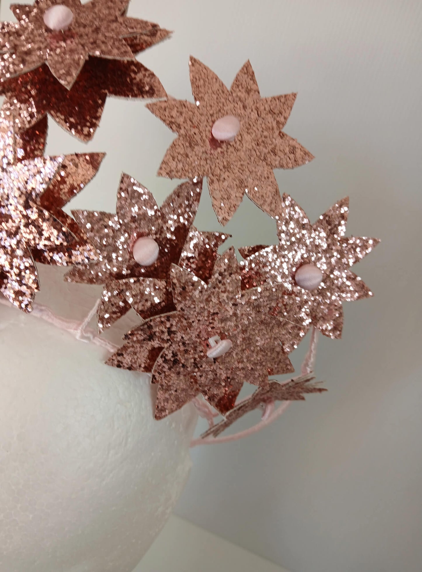 A picture of a Pink Pleather Millinery Crown by Melissa Rath Millinery.