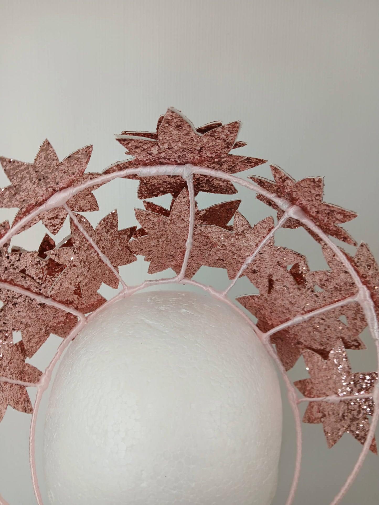 A picture of a Pink Pleather Millinery Crown by Melissa Rath Millinery.