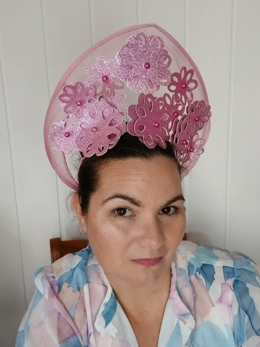 A picture of a Pink Pleather Millinery Halo Crown by Melissa Rath Millinery