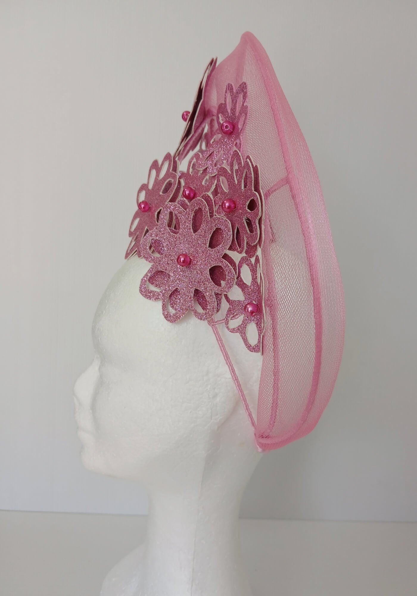 A picture of a Pink Pleather Millinery Halo Crown by Melissa Rath Millinery