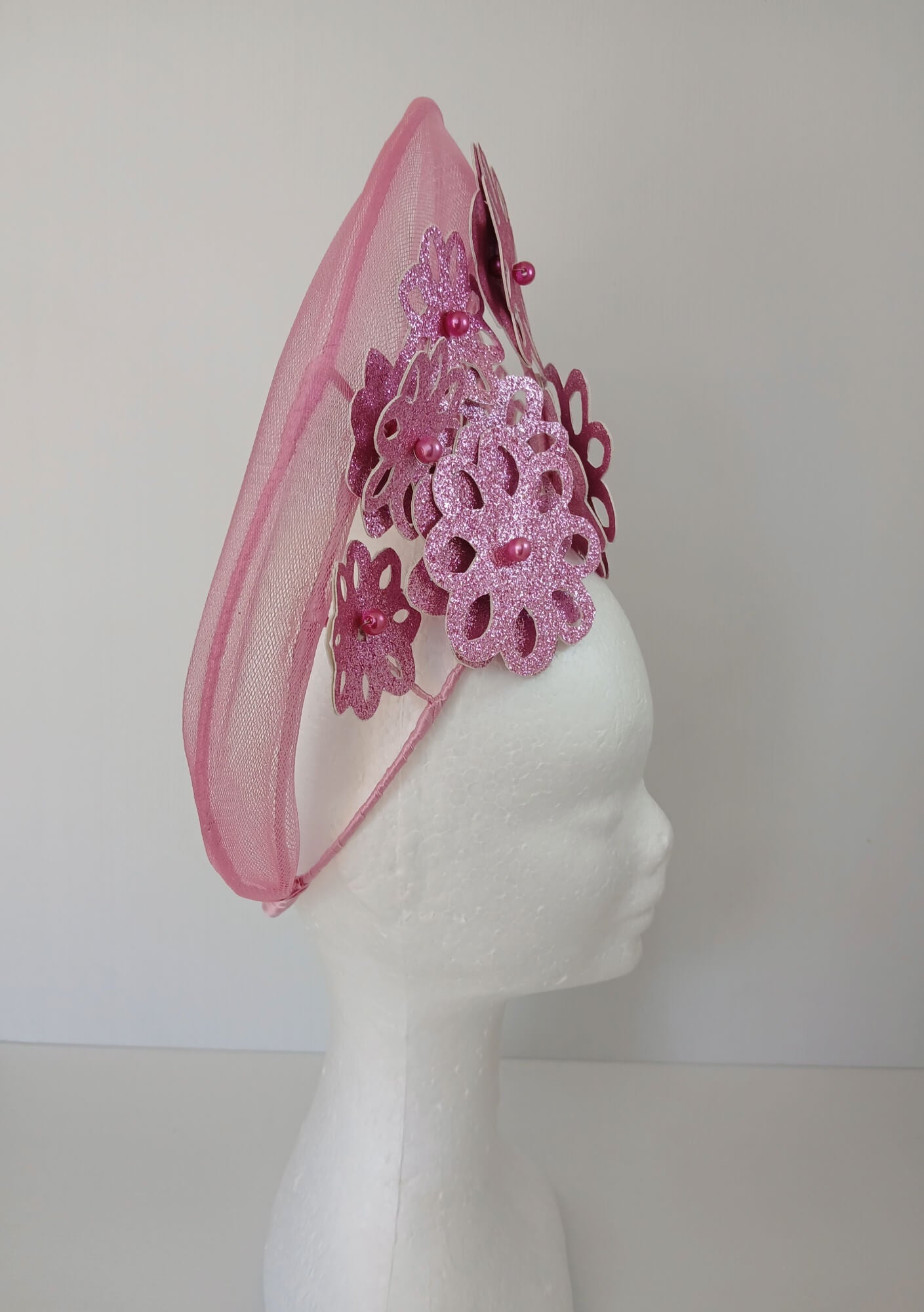 A picture of a Pink Pleather Millinery Halo Crown by Melissa Rath Millinery