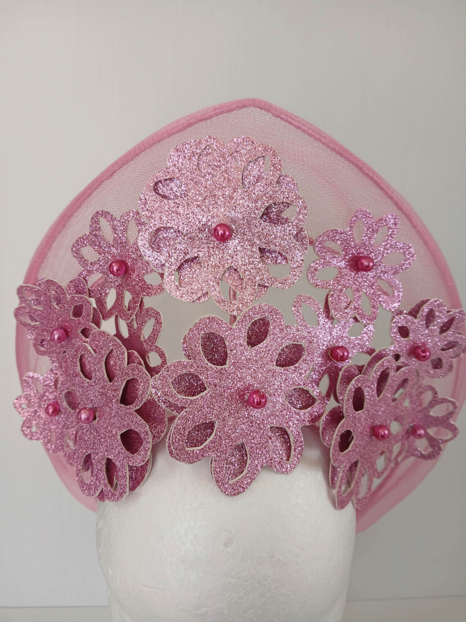 A picture of a Pink Pleather Millinery Halo Crown by Melissa Rath Millinery