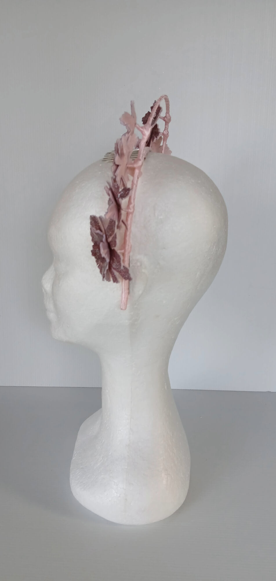 A picture of a Pink Pleather Millinery Halo Crown by Melissa Rath Millinery.