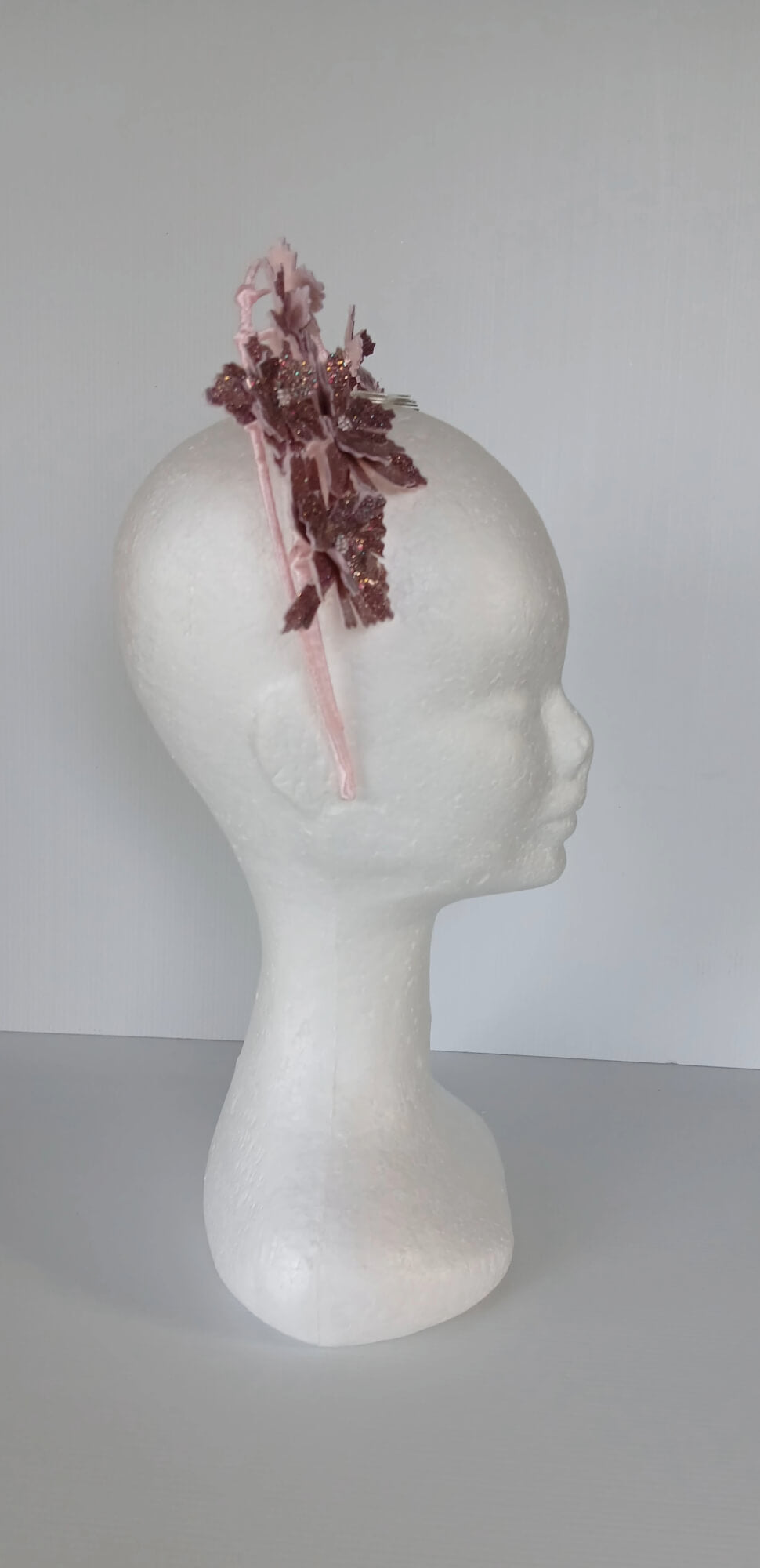 A picture of a Pink Pleather Millinery Halo Crown by Melissa Rath Millinery.