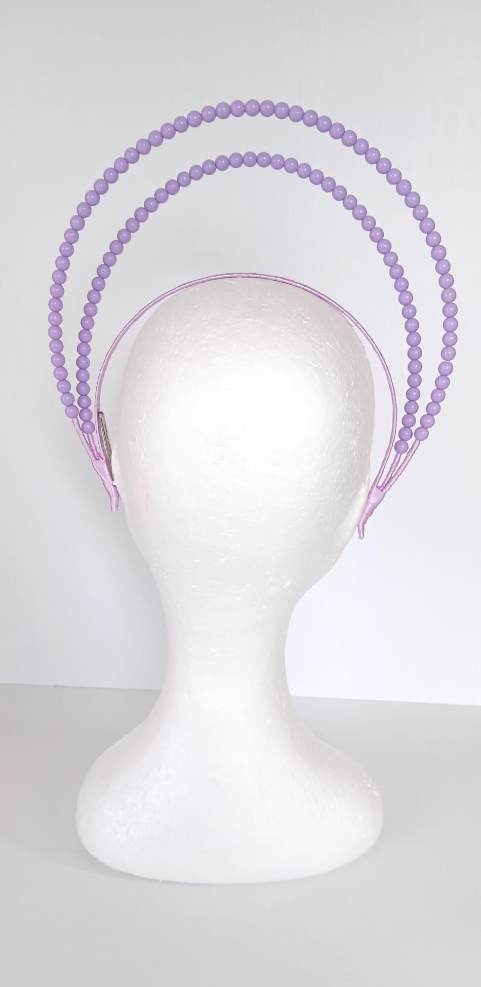 A picture of a Purple Beaded Millinery Headband by Melissa Rath Millinery.