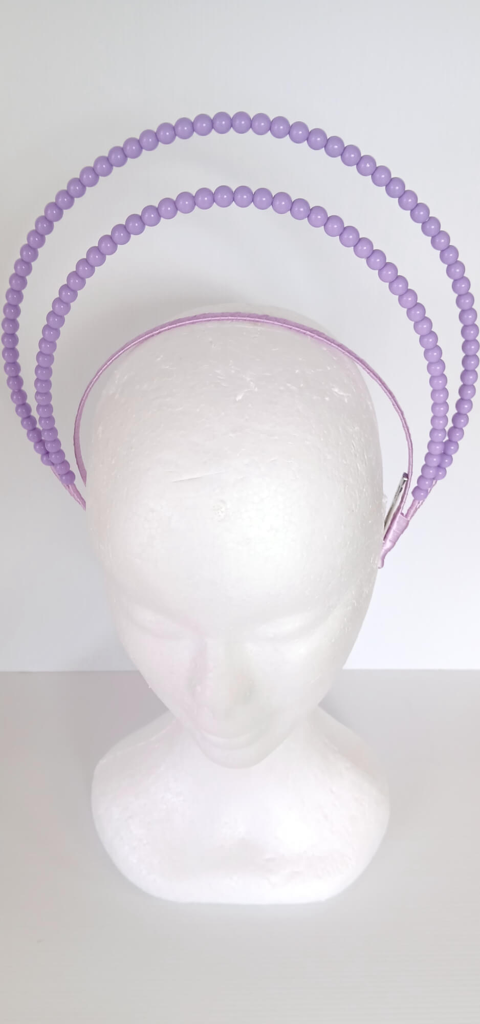 A picture of a Purple Beaded Millinery Headband by Melissa Rath Millinery.