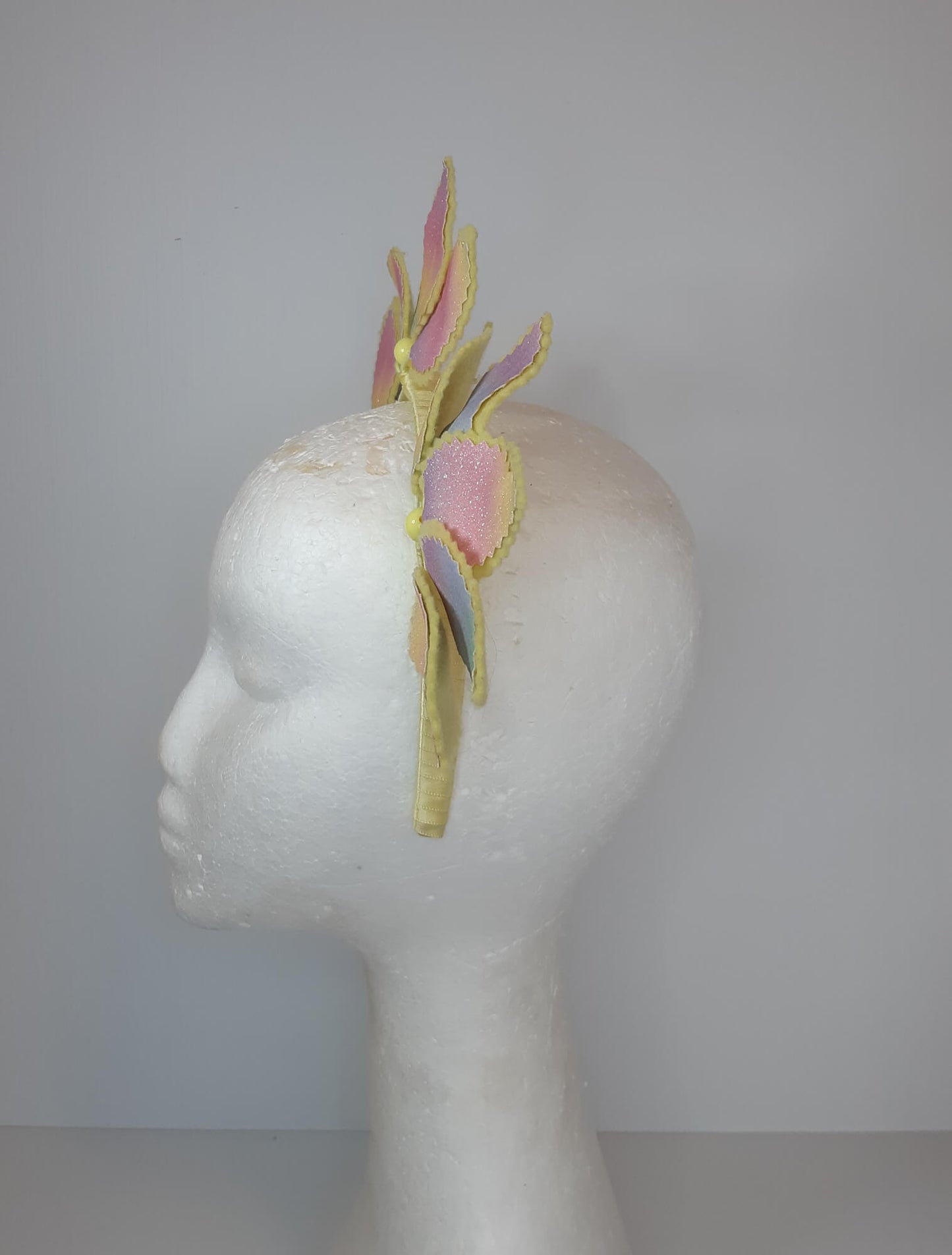 A picture of a Rainbow Pleather Millinery Headband by Melissa Rath Millinery.
