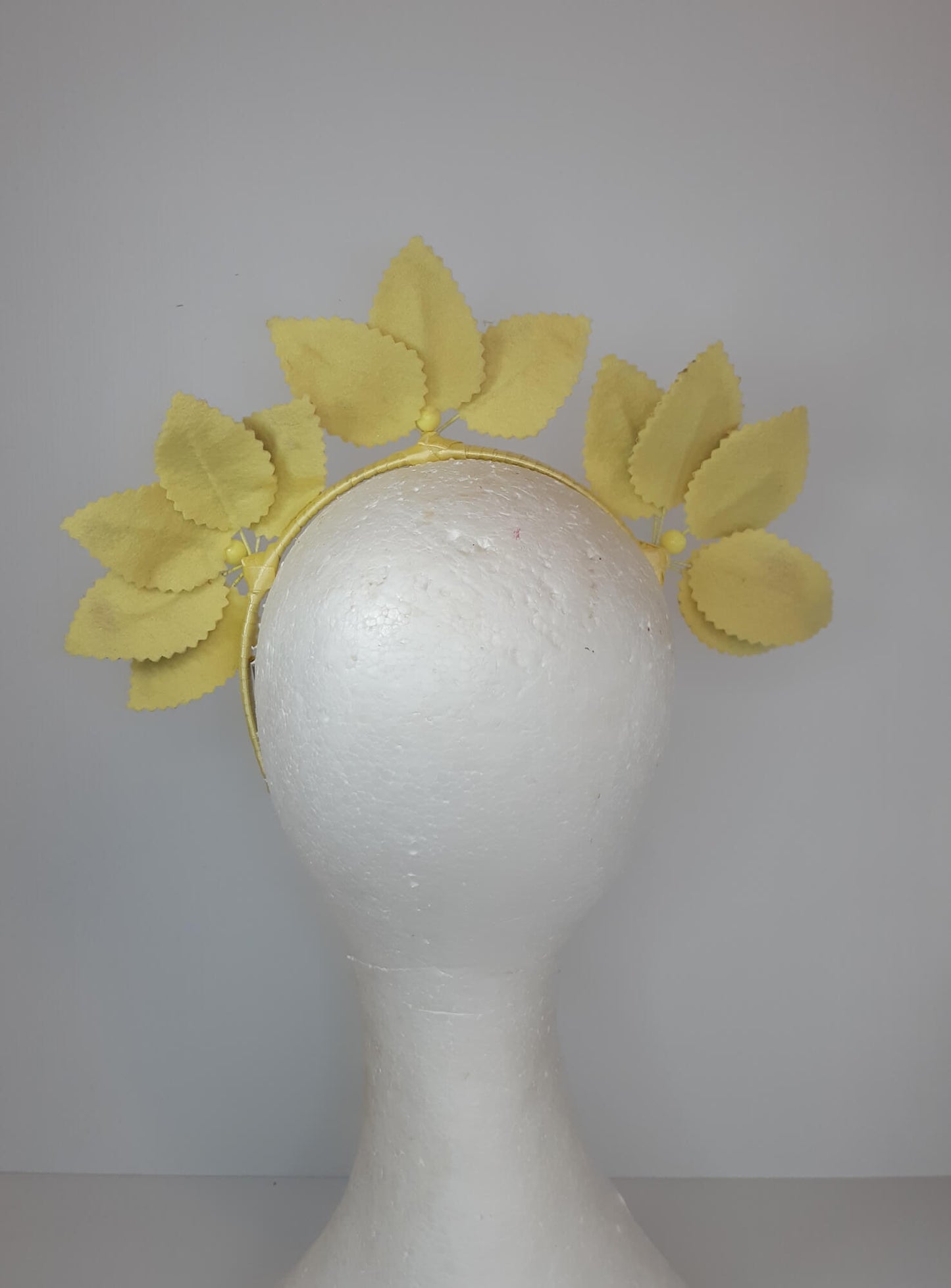A picture of a Rainbow Pleather Millinery Headband by Melissa Rath Millinery.