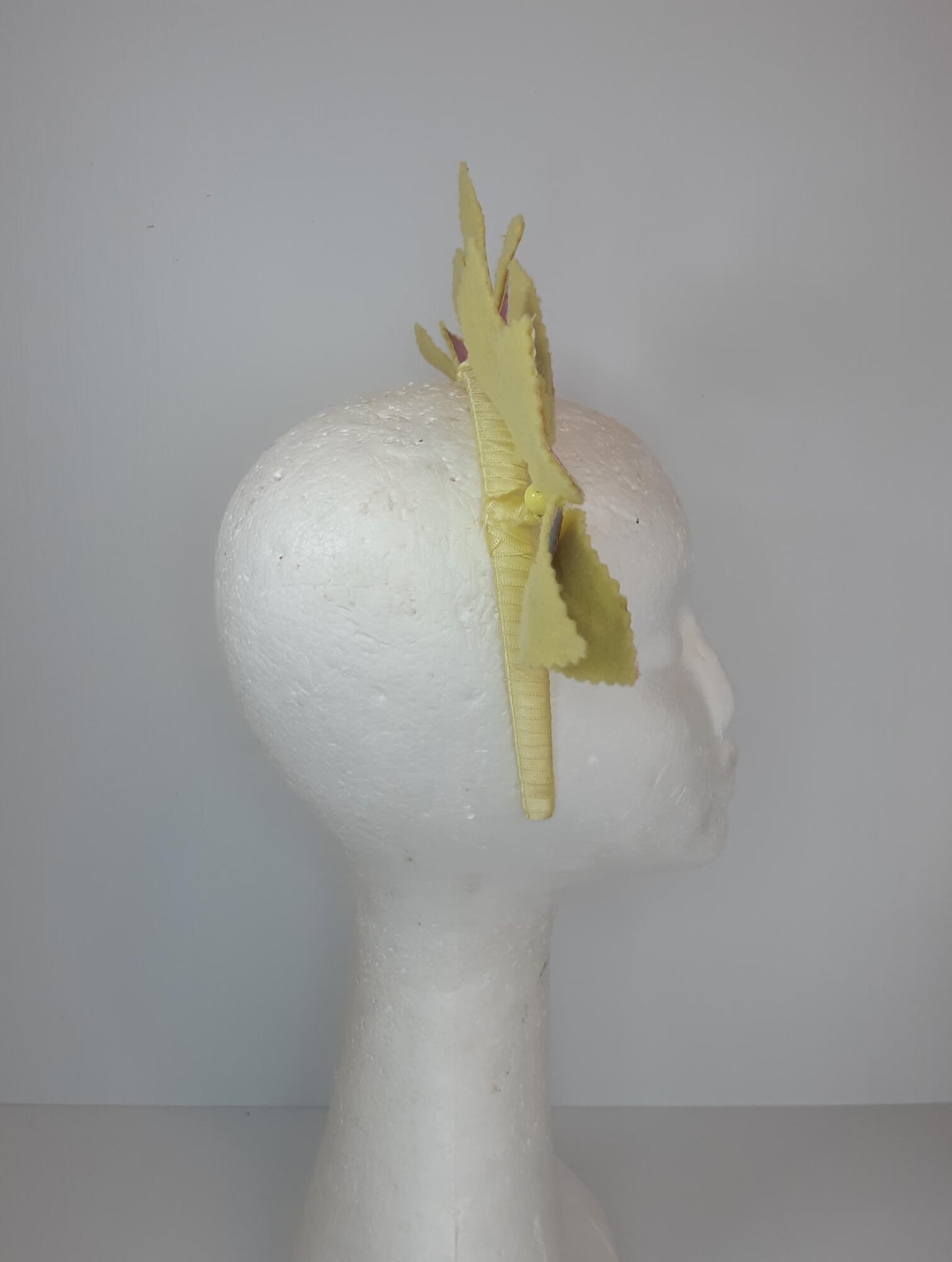 A picture of a Rainbow Pleather Millinery Headband by Melissa Rath Millinery.