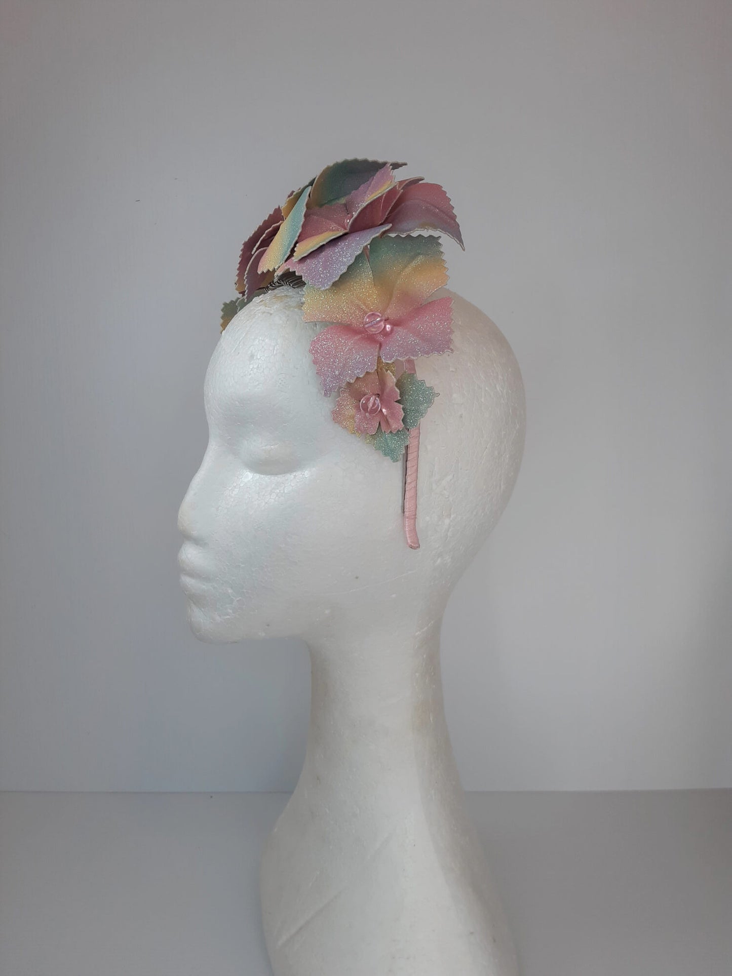 A picture of a Rainbow Pleather Millinery Crown by Melissa Rath Millinery.