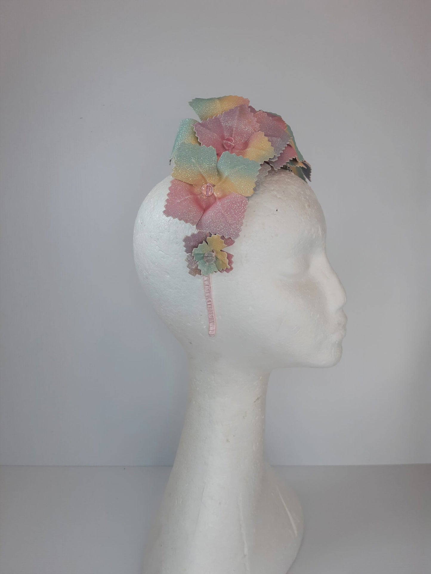 A picture of a Rainbow Pleather Millinery Crown by Melissa Rath Millinery.
