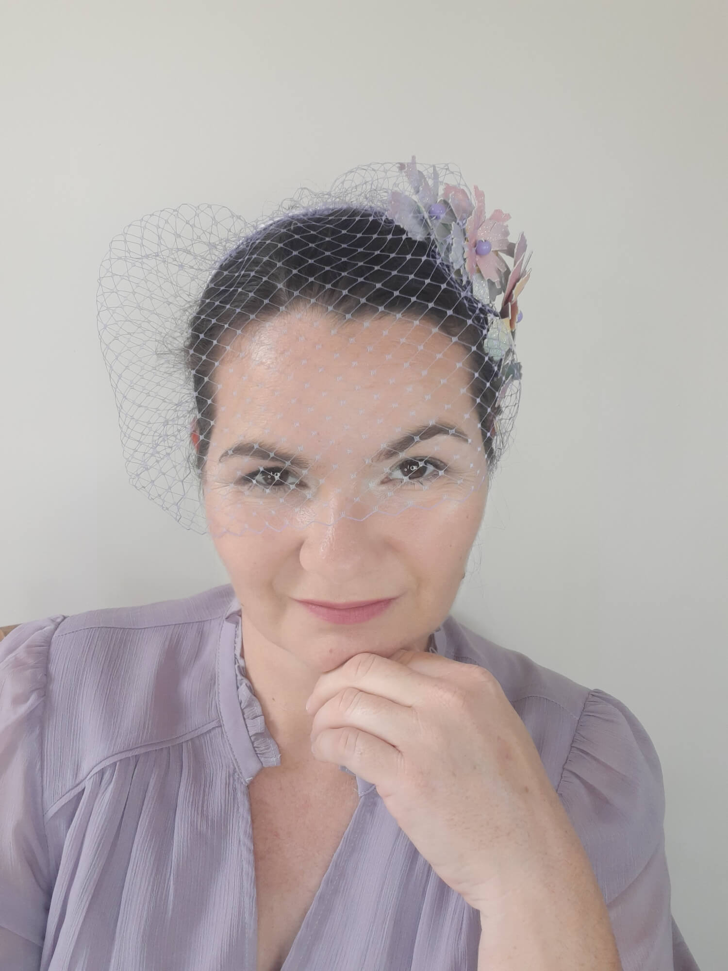 A picture of a Rainbow Veiled Millinery Headband by Melissa Rath Millinery.