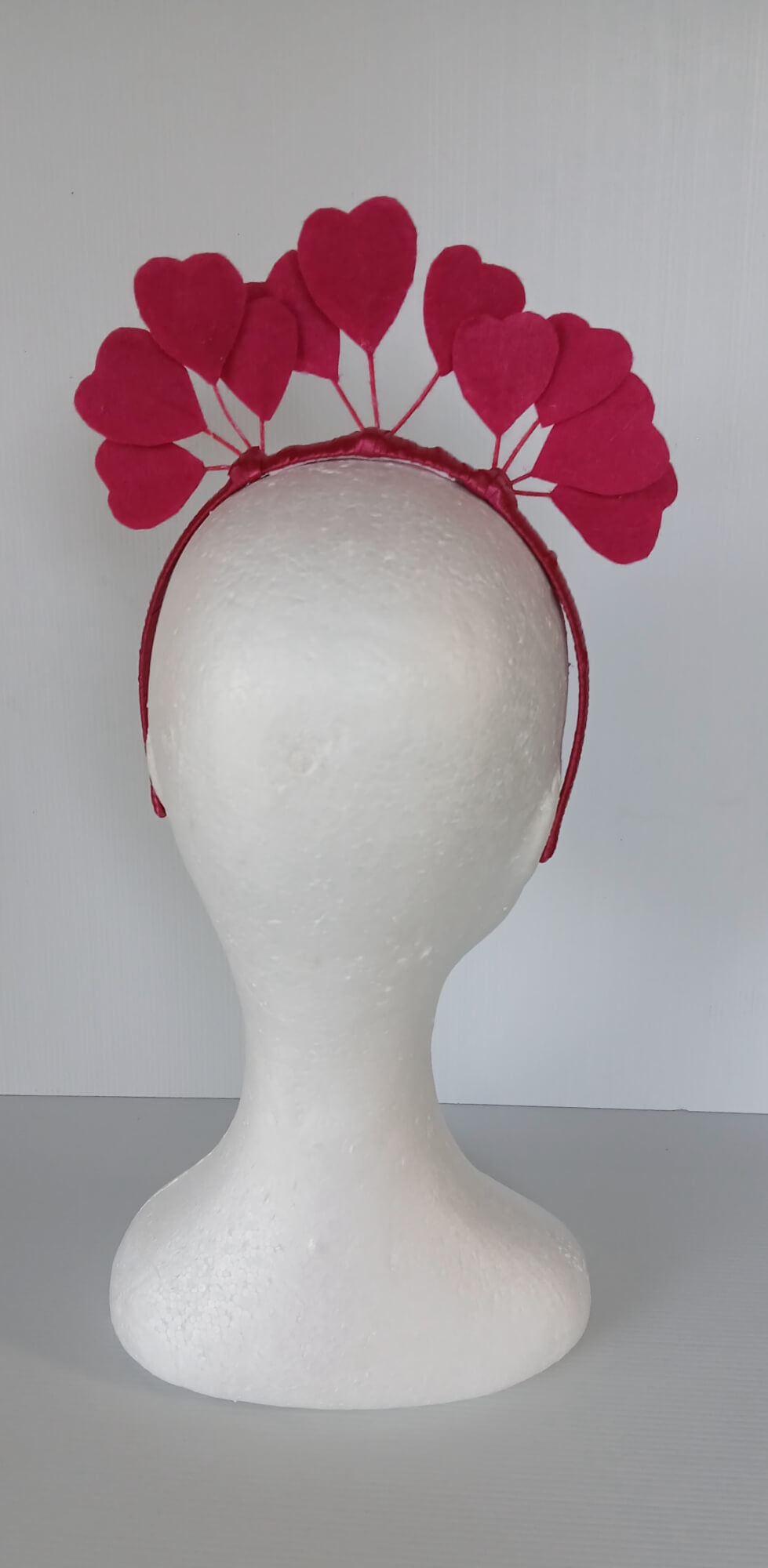 A picture of a red heart headband in pleather and felt by Melissa Rath Millinery