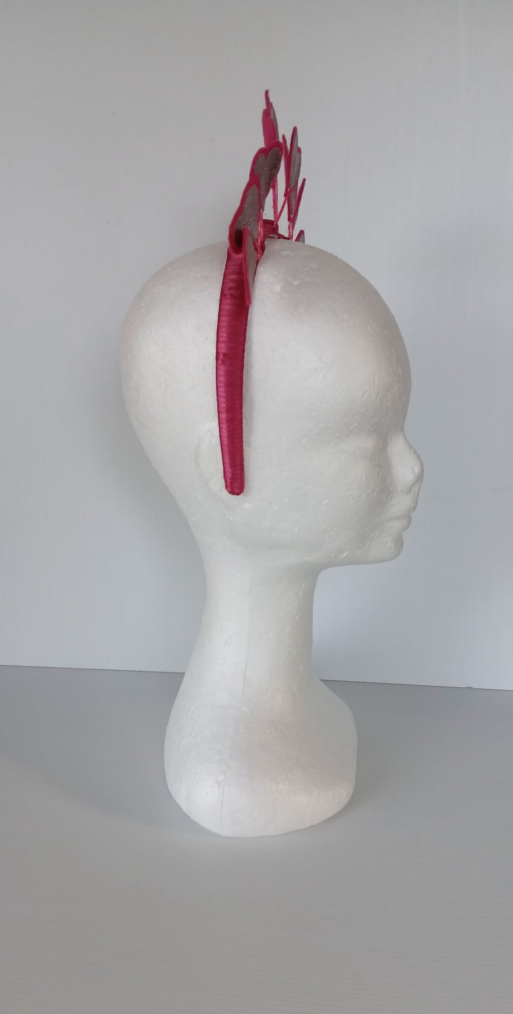 A picture of a red heart headband in pleather and felt by Melissa Rath Millinery