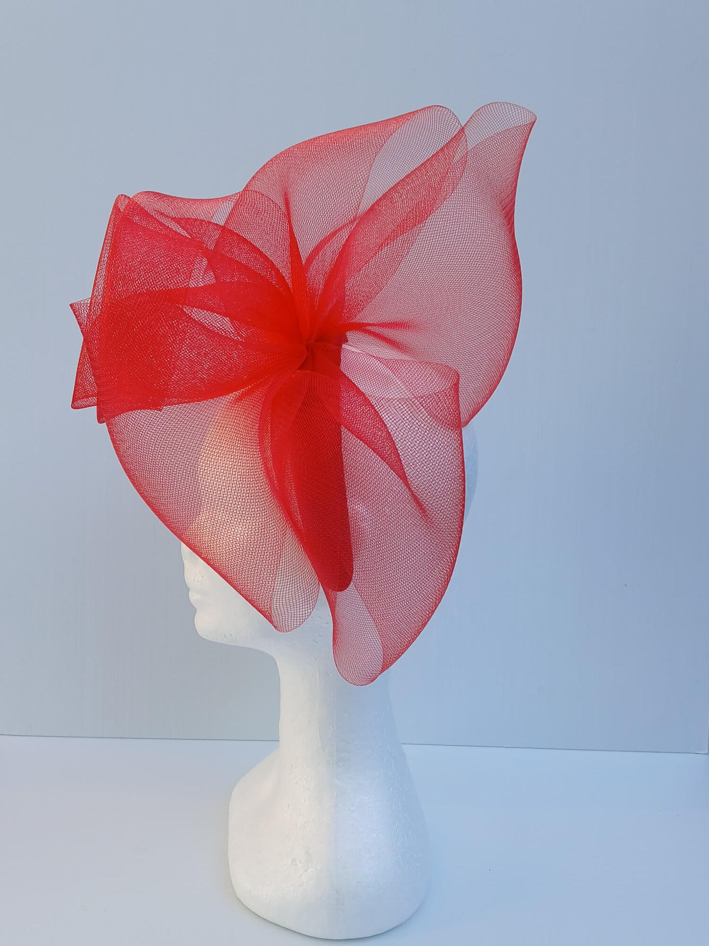 An image of a Red Padded Headband with Crinoline Bow and Rose by Melissa Rath Millinery.
