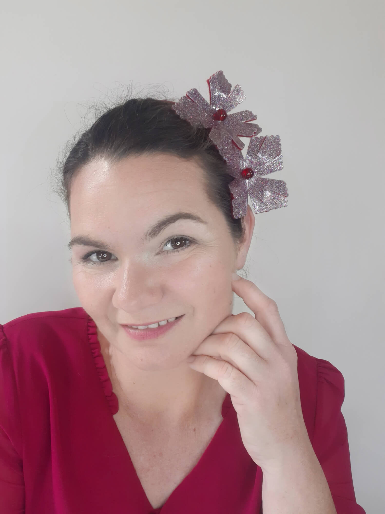 A picture of a red headband in pleather and felt by Melissa Rath Millinery.