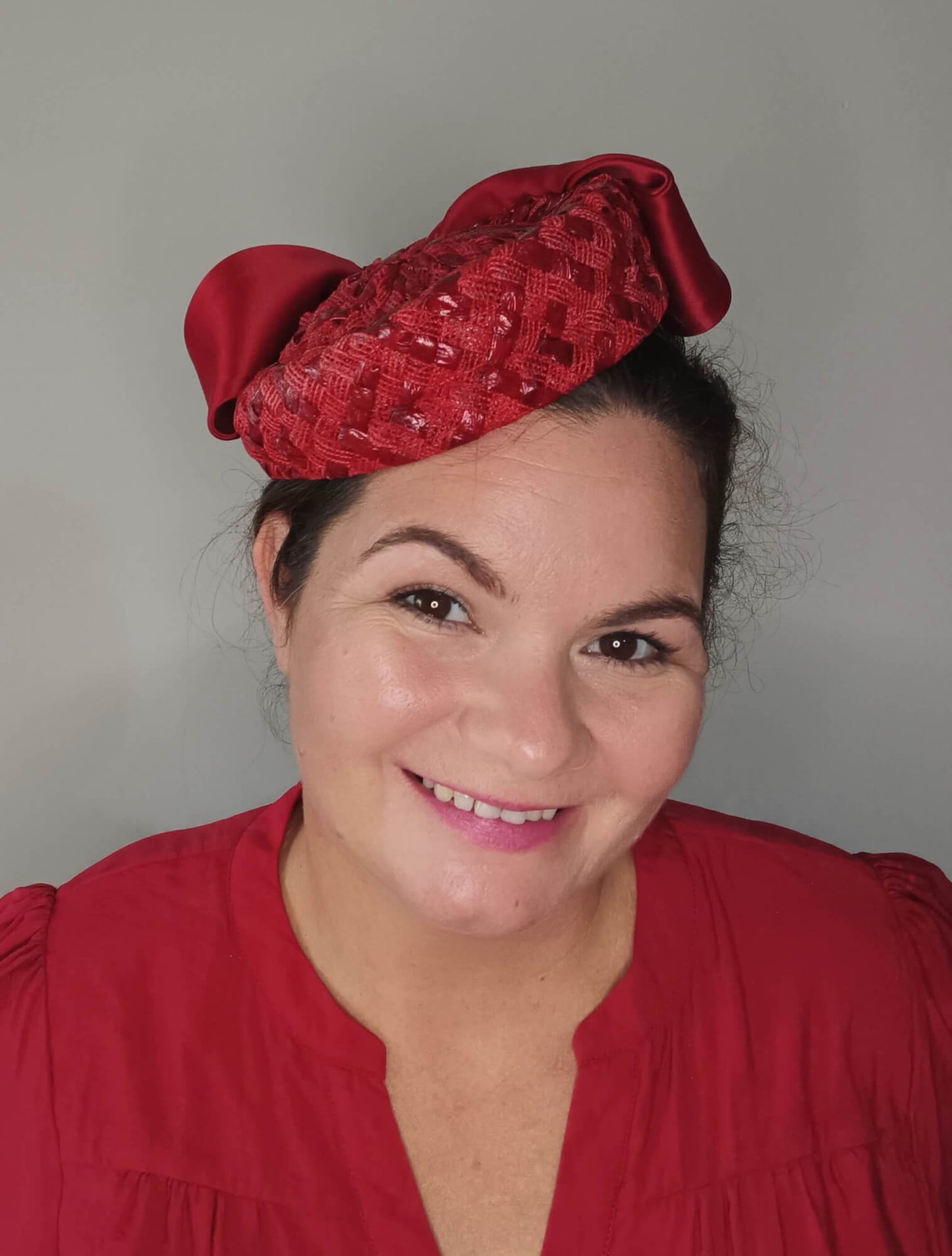 A picture of a Red Swiss Straw Braid Pillbox Hat by Melissa Rath Millinery