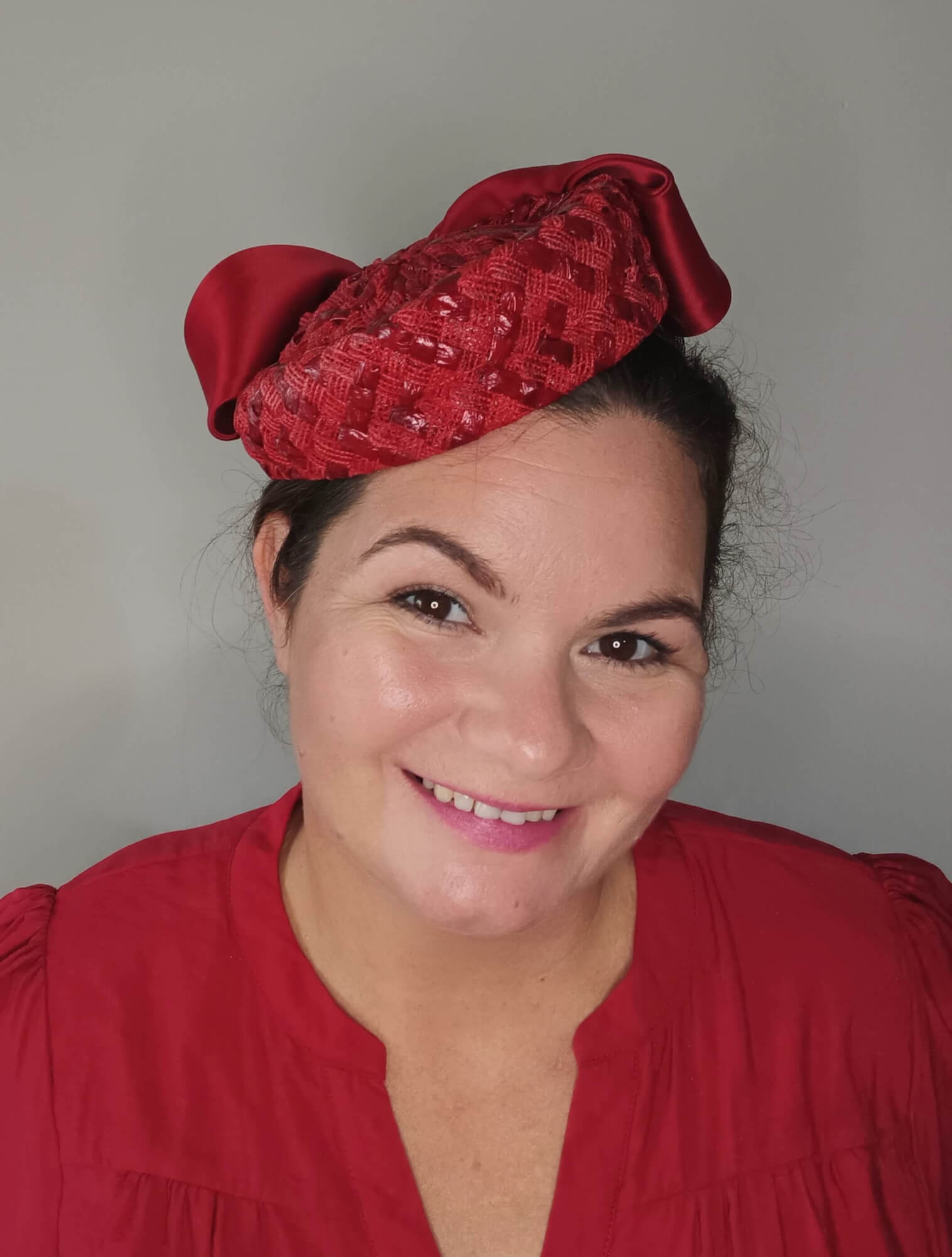 A picture of a Red Swiss Straw Braid Pillbox Hat by Melissa Rath Millinery