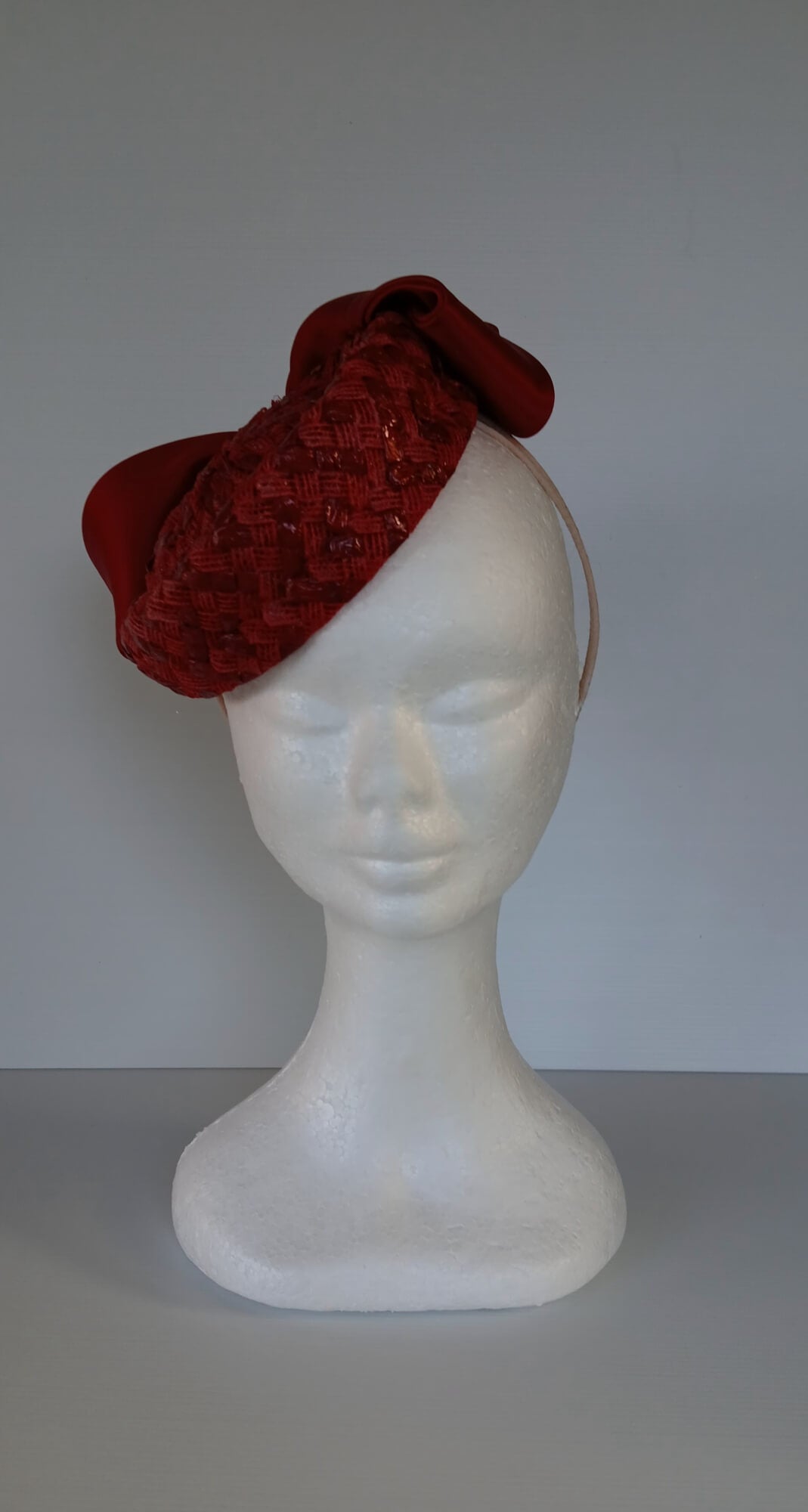 A picture of a Red Swiss Straw Braid Pillbox Hat by Melissa Rath Millinery