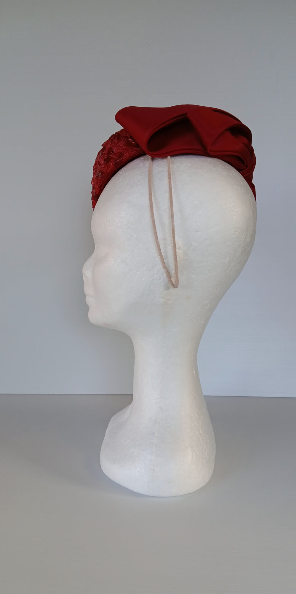 A picture of a Red Swiss Straw Braid Pillbox Hat by Melissa Rath Millinery